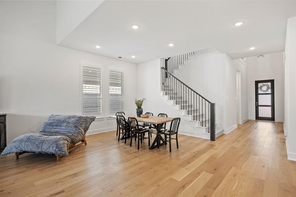 1807 Gateway Lane Van Alstyne, TX 75495 - Photo 6 of 33 a living room with furniture and a dining table with wooden floor
