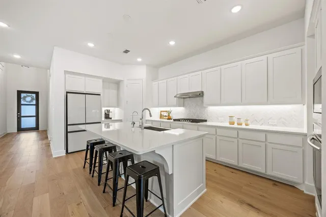 a large kitchen with cabinets