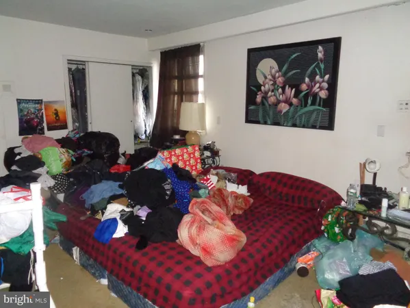 a bed room with furniture and a window