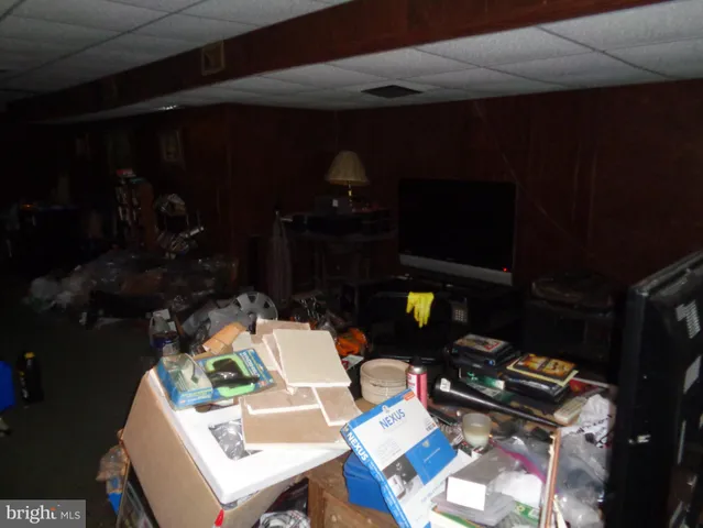 a backyard of a house with barbeque oven table and chairs