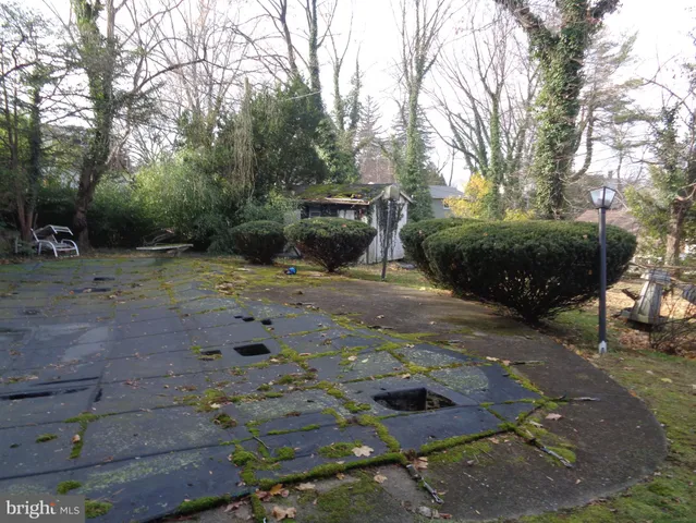 a view of street and electric pole on its side