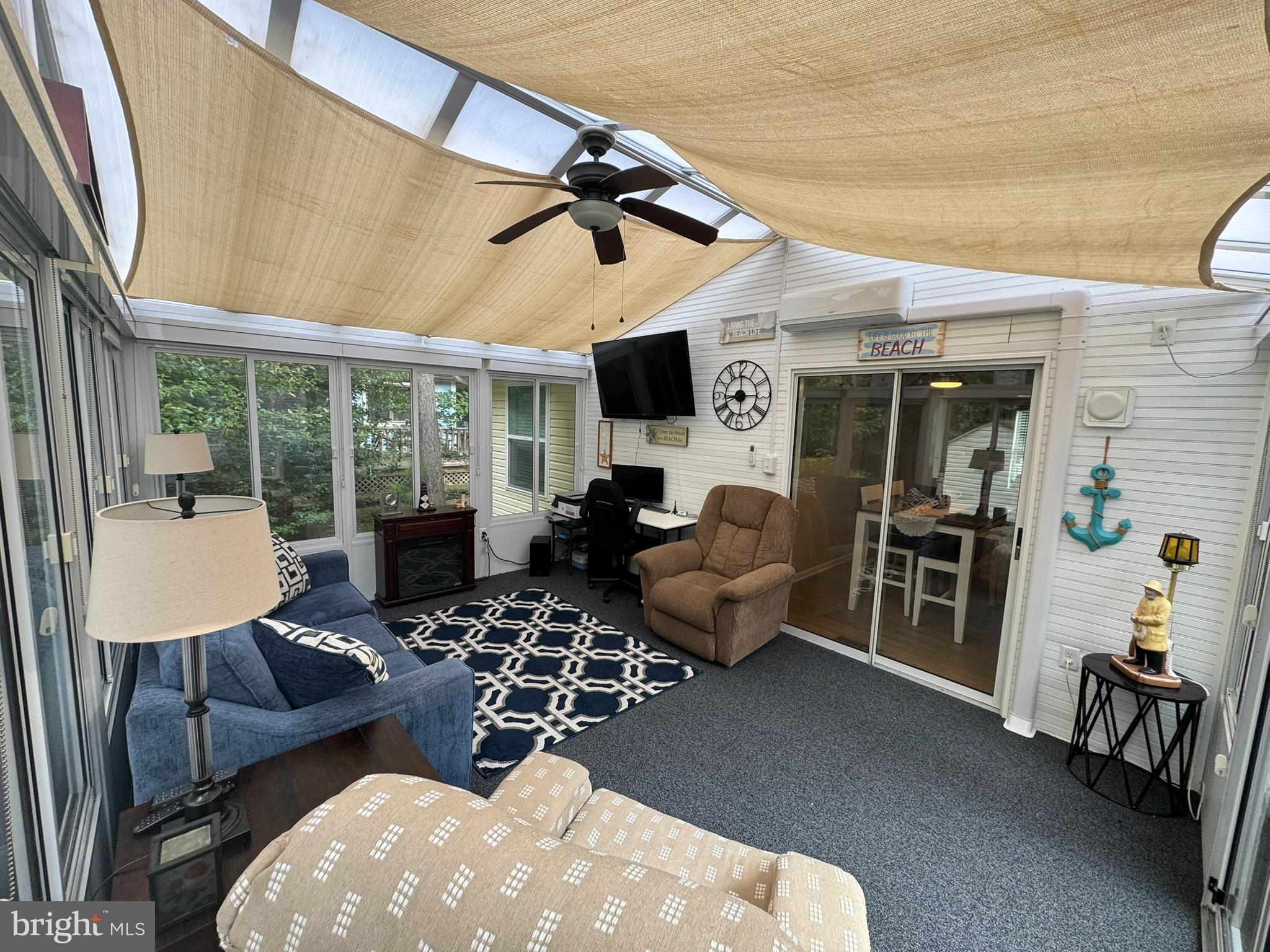 85 Pinehurst Road Ocean Pines, MD 21811 - Photo 6 of 30 a living room with furniture large window and flat screen tv