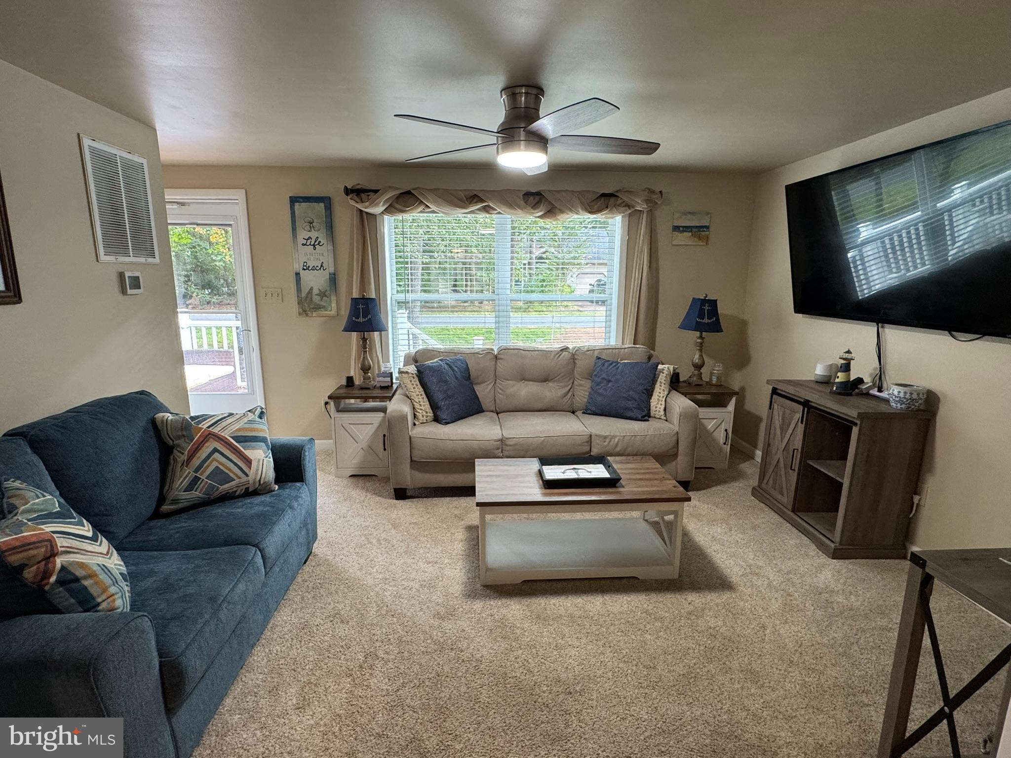 85 Pinehurst Road Ocean Pines, MD 21811 - Photo 8 of 30 a living room with furniture and a flat screen tv