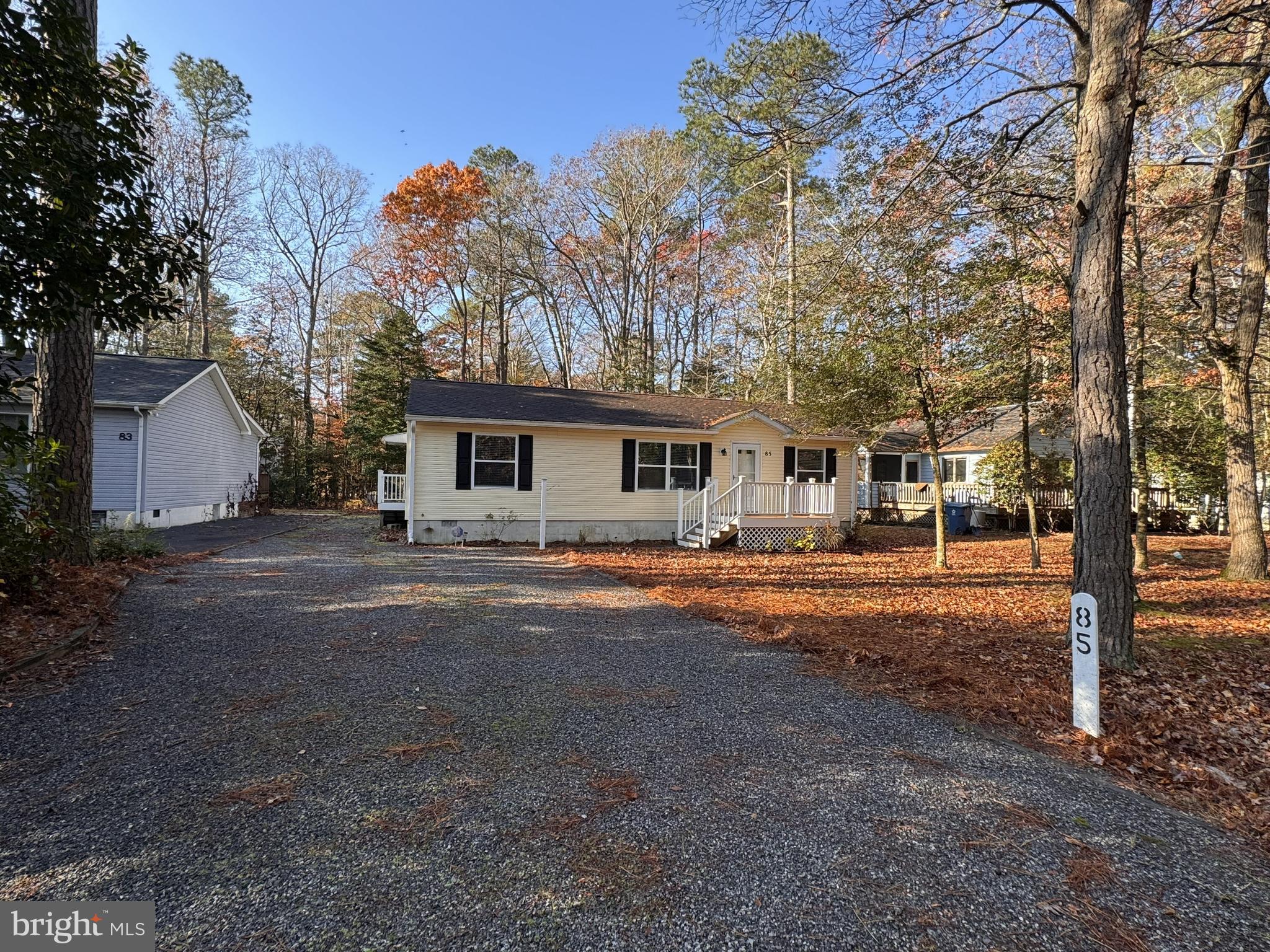 85 Pinehurst Road Ocean Pines, MD 21811 - Photo 10 of 30 a front view of a house with a yard and garage