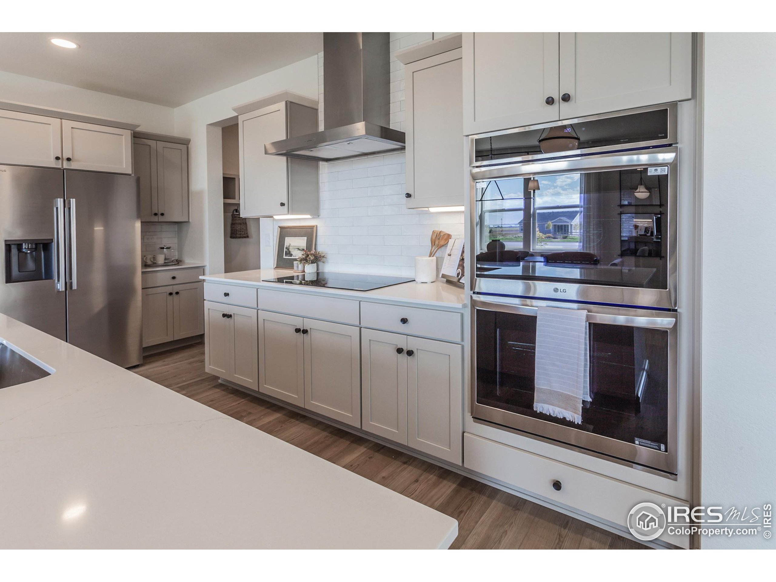 6079 Red Barn Road Fort Collins, CO 80528 - Photo 12 of 41 a kitchen with stainless steel appliances granite countertop a stove a sink and a refrigerator
