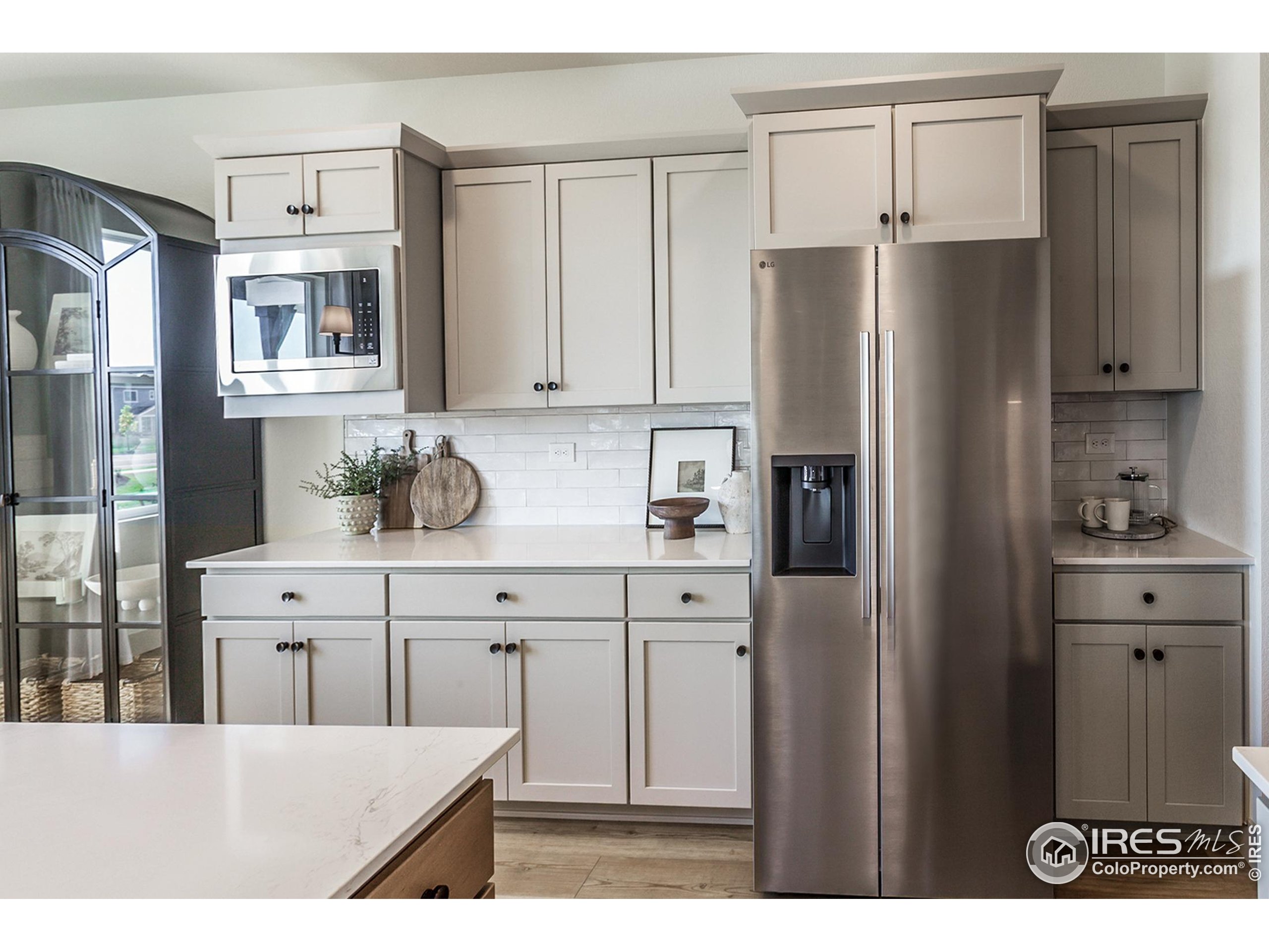 6079 Red Barn Road Fort Collins, CO 80528 - Photo 18 of 41 a kitchen with stainless steel appliances a refrigerator sink and cabinets