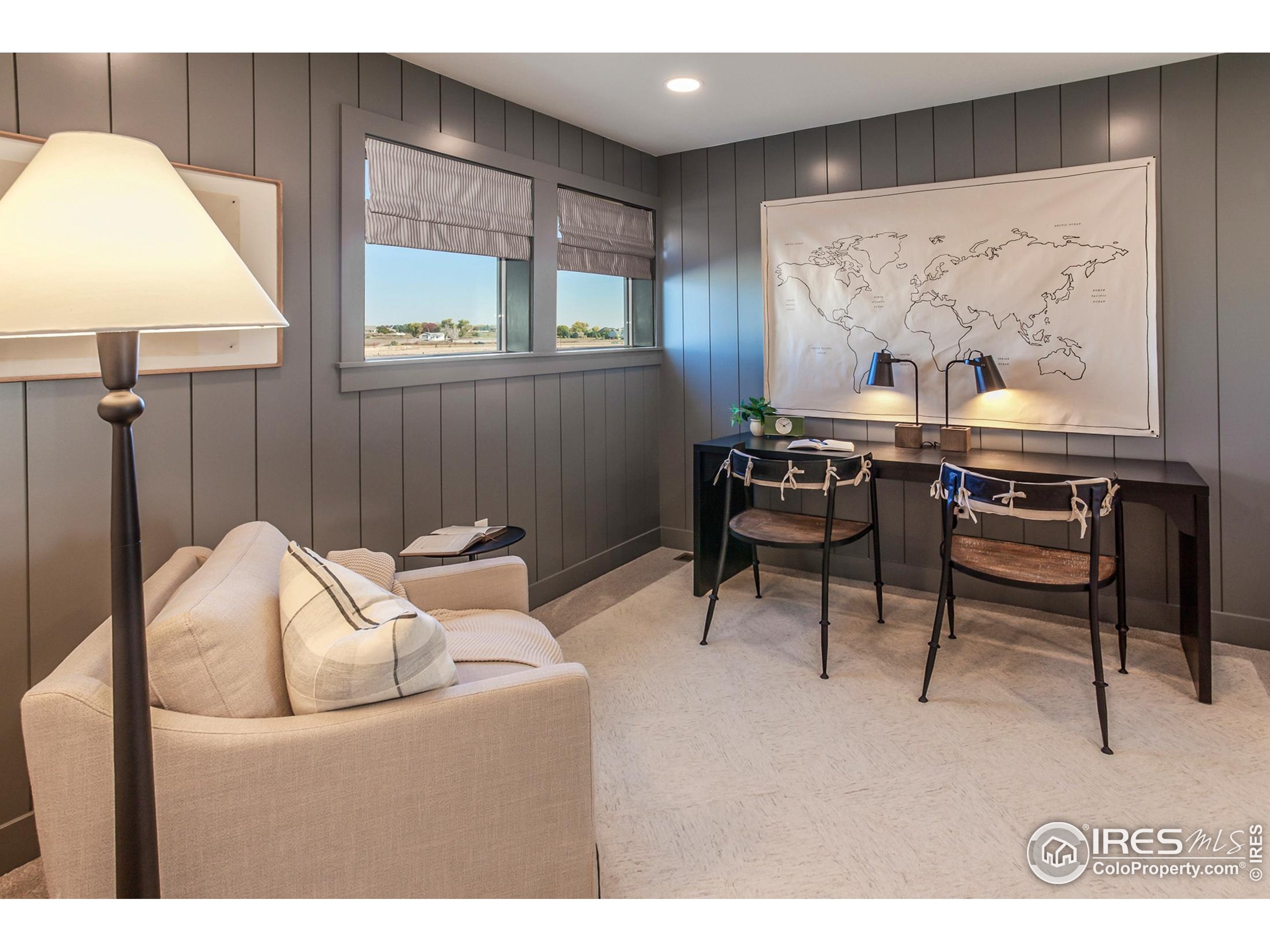 6079 Red Barn Road Fort Collins, CO 80528 - Photo 20 of 41 a living room with furniture and a wall painting