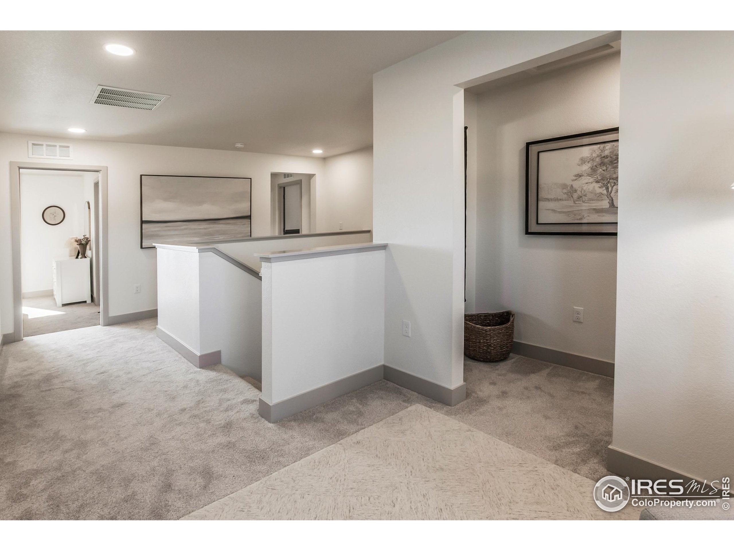 6079 Red Barn Road Fort Collins, CO 80528 - Photo 21 of 41 a kitchen with white cabinets and stainless steel appliances