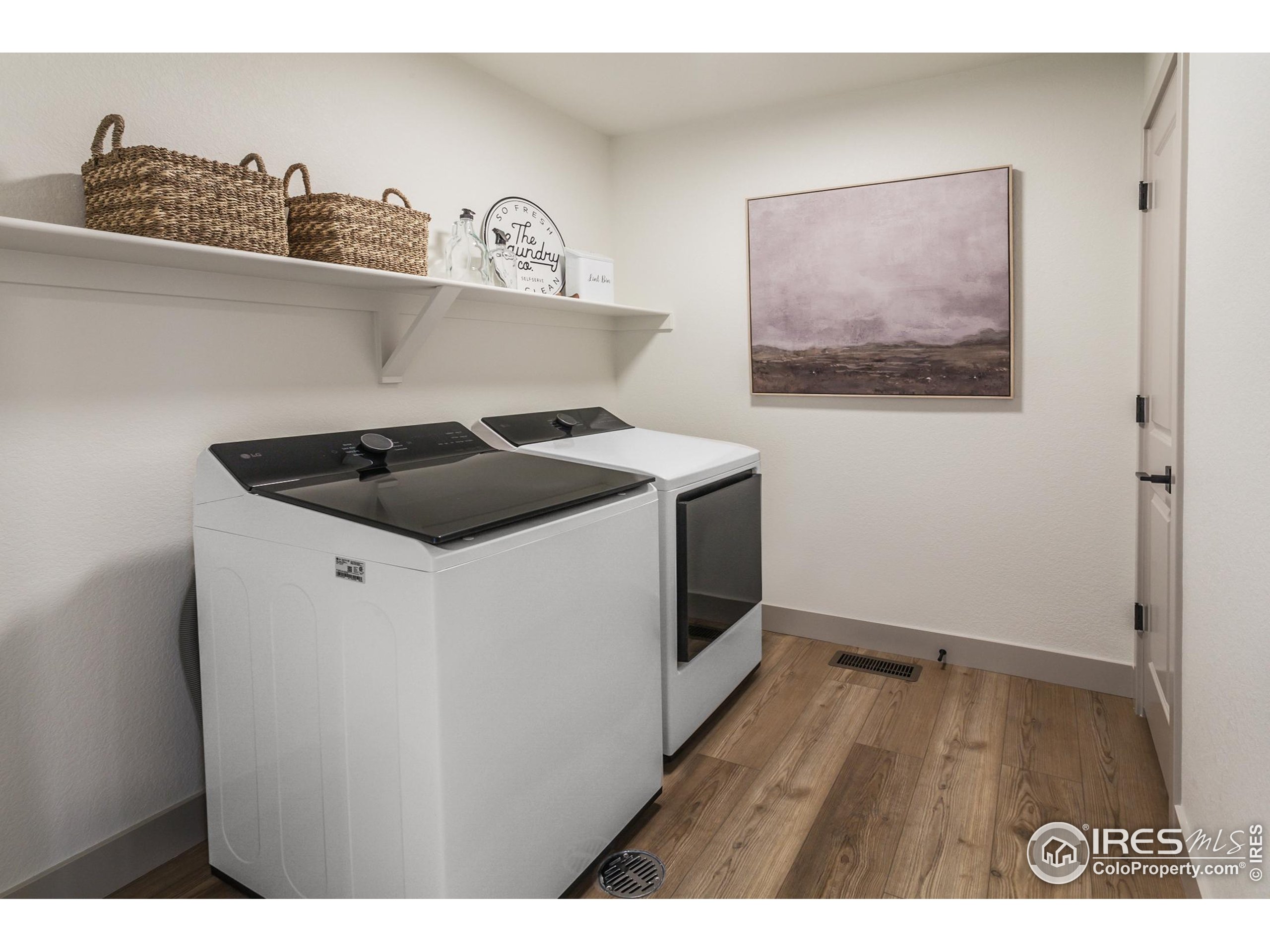 6079 Red Barn Road Fort Collins, CO 80528 - Photo 28 of 41 a kitchen view of a stove and wooden floor
