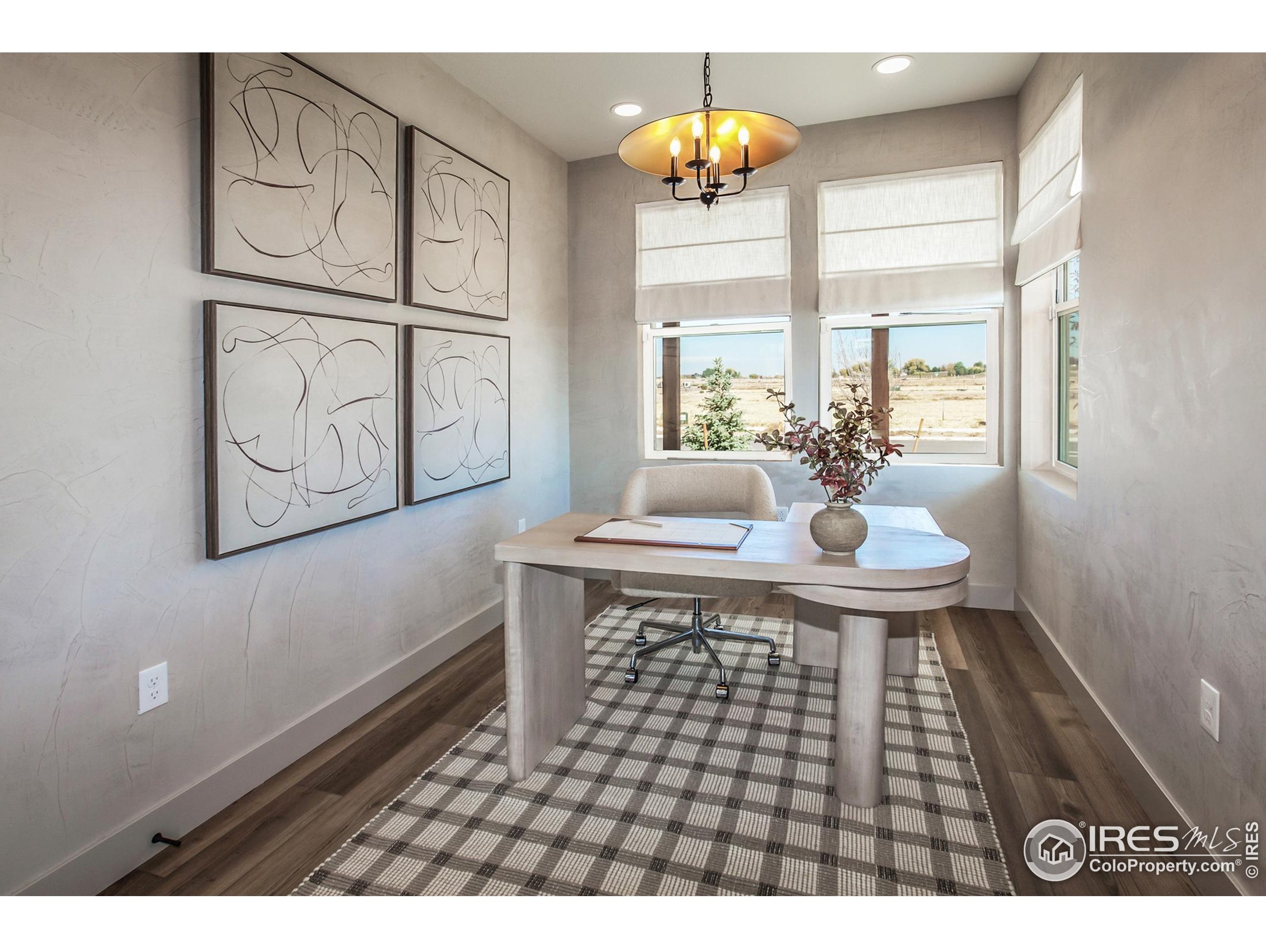 6079 Red Barn Road Fort Collins, CO 80528 - Photo 3 of 41 a dining room with wooden floor and a chandelier