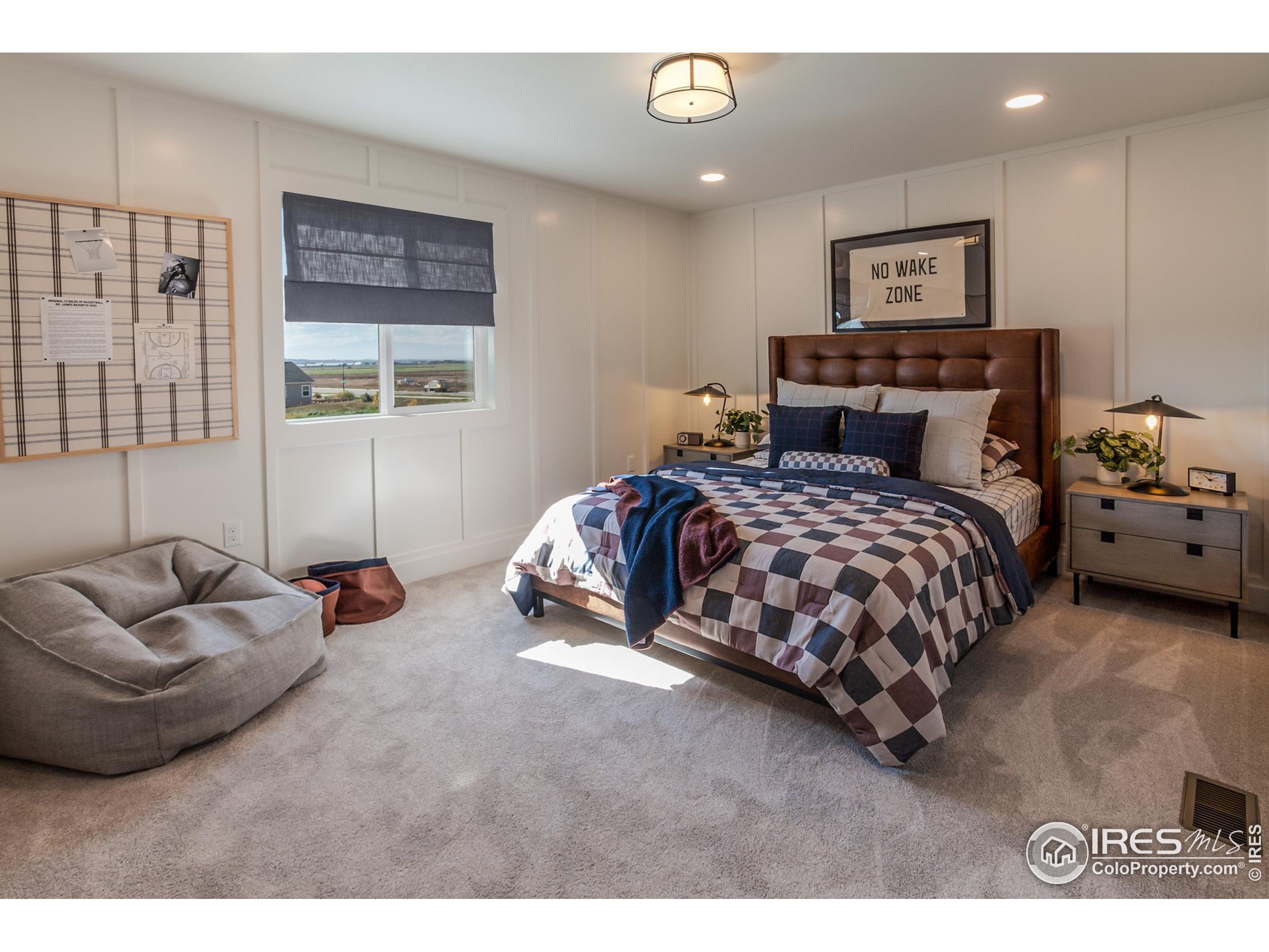 6079 Red Barn Road Fort Collins, CO 80528 - Photo 33 of 41 a bedroom with a bed and glass window