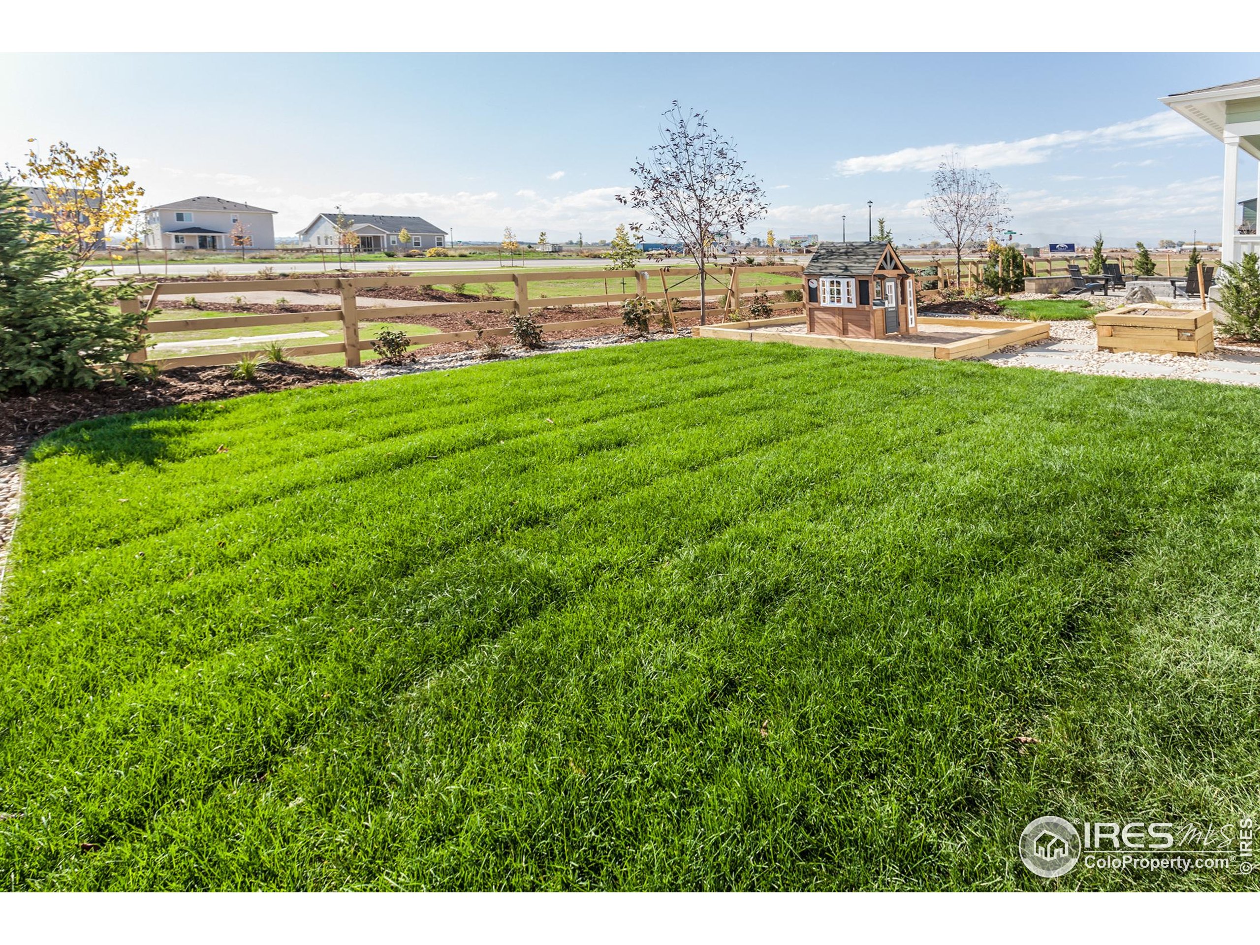 6079 Red Barn Road Fort Collins, CO 80528 - Photo 36 of 41 a view of a lake with a big yard and large trees