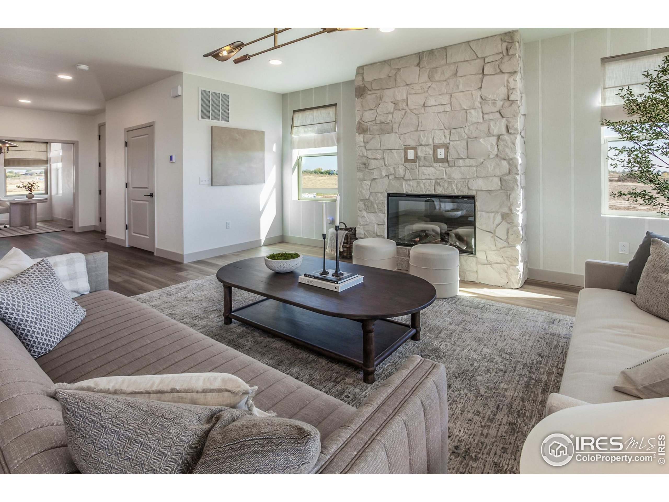 6079 Red Barn Road Fort Collins, CO 80528 - Photo 7 of 41 a living room with furniture and a fireplace