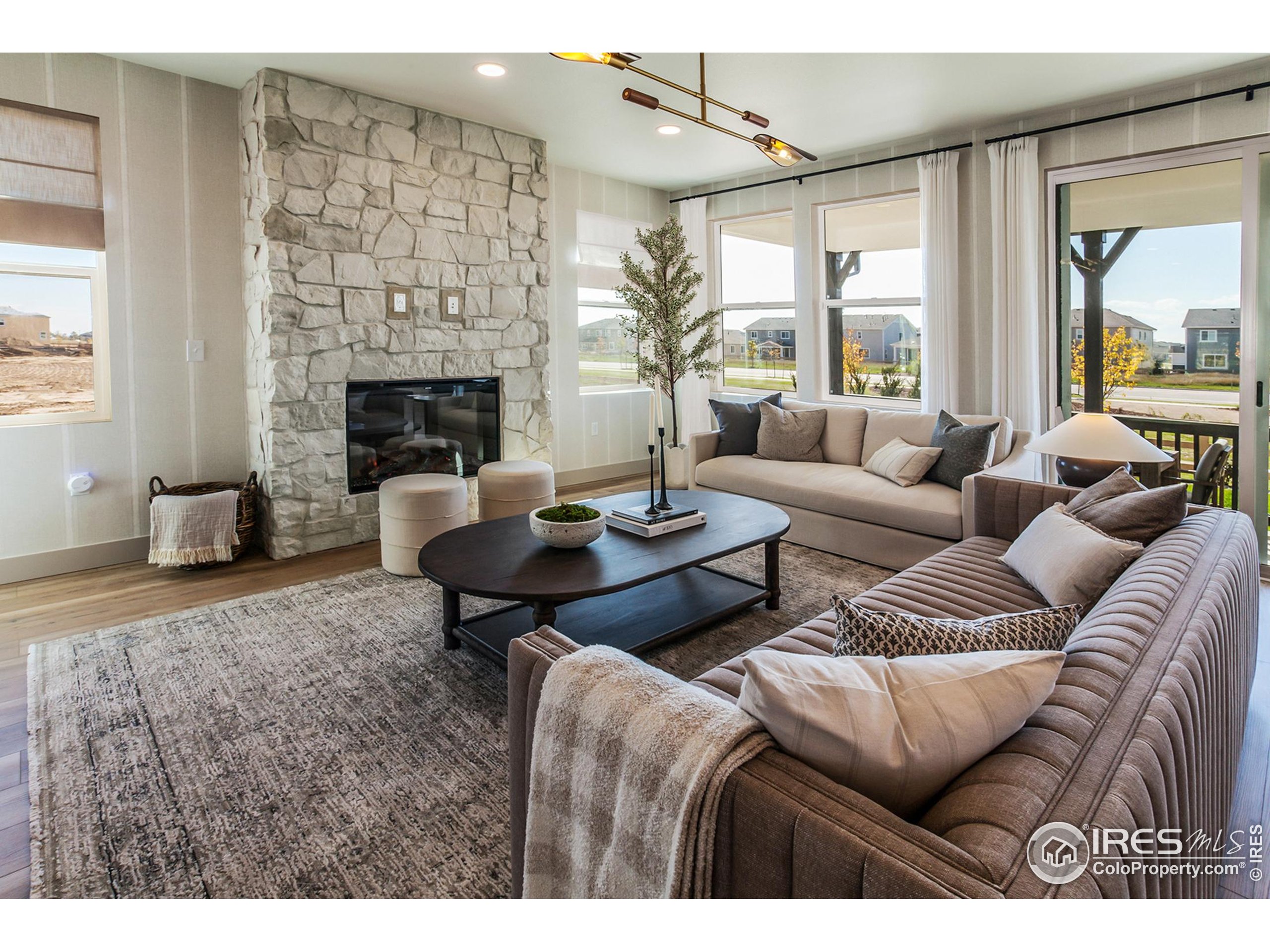 6079 Red Barn Road Fort Collins, CO 80528 - Photo 8 of 41 a living room with furniture and a fireplace