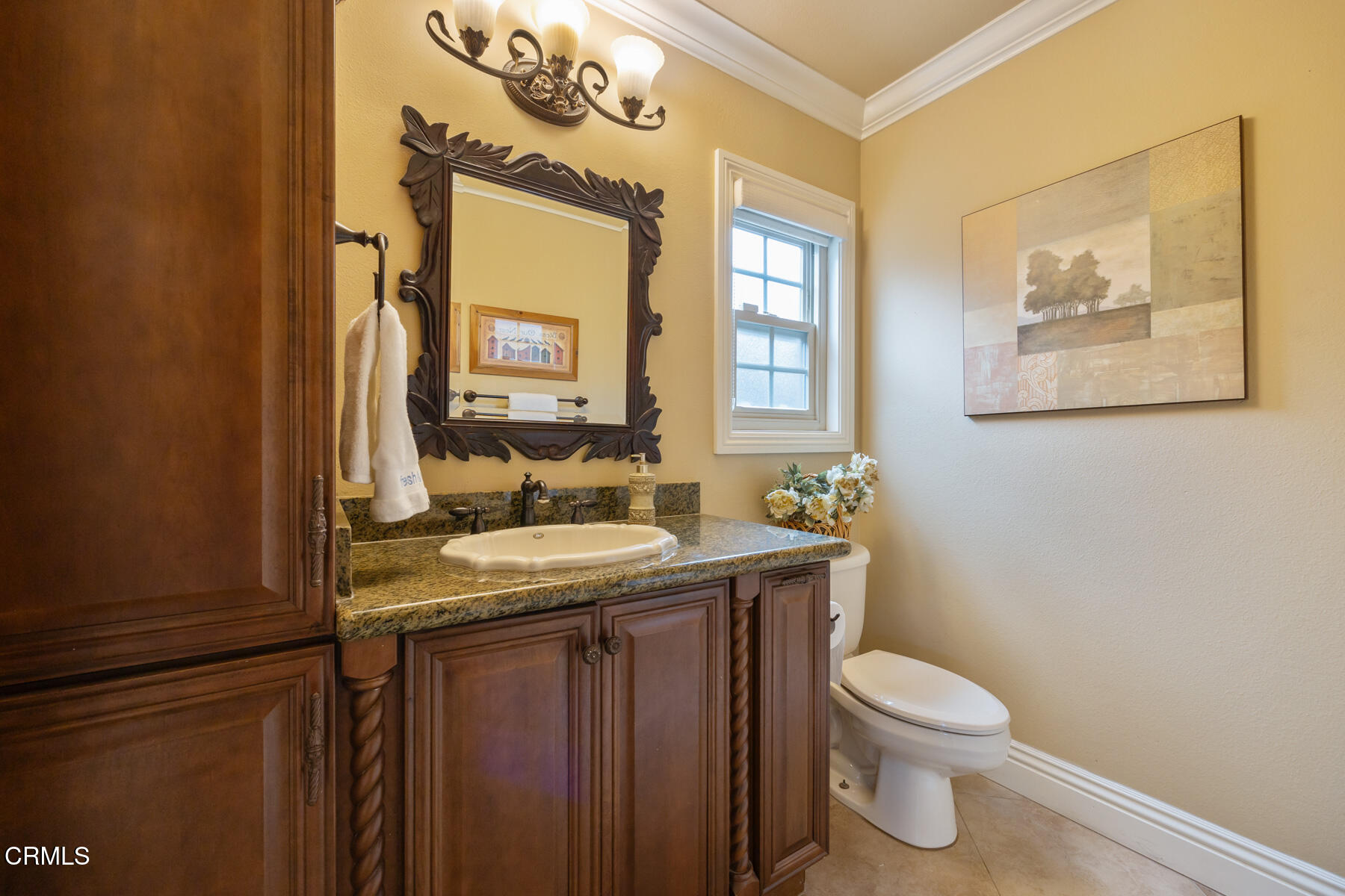 22671 Cheryl Way Lake Forest, CA 92630 - Photo 21 of 51 a bathroom with a granite countertop toilet sink and mirror
