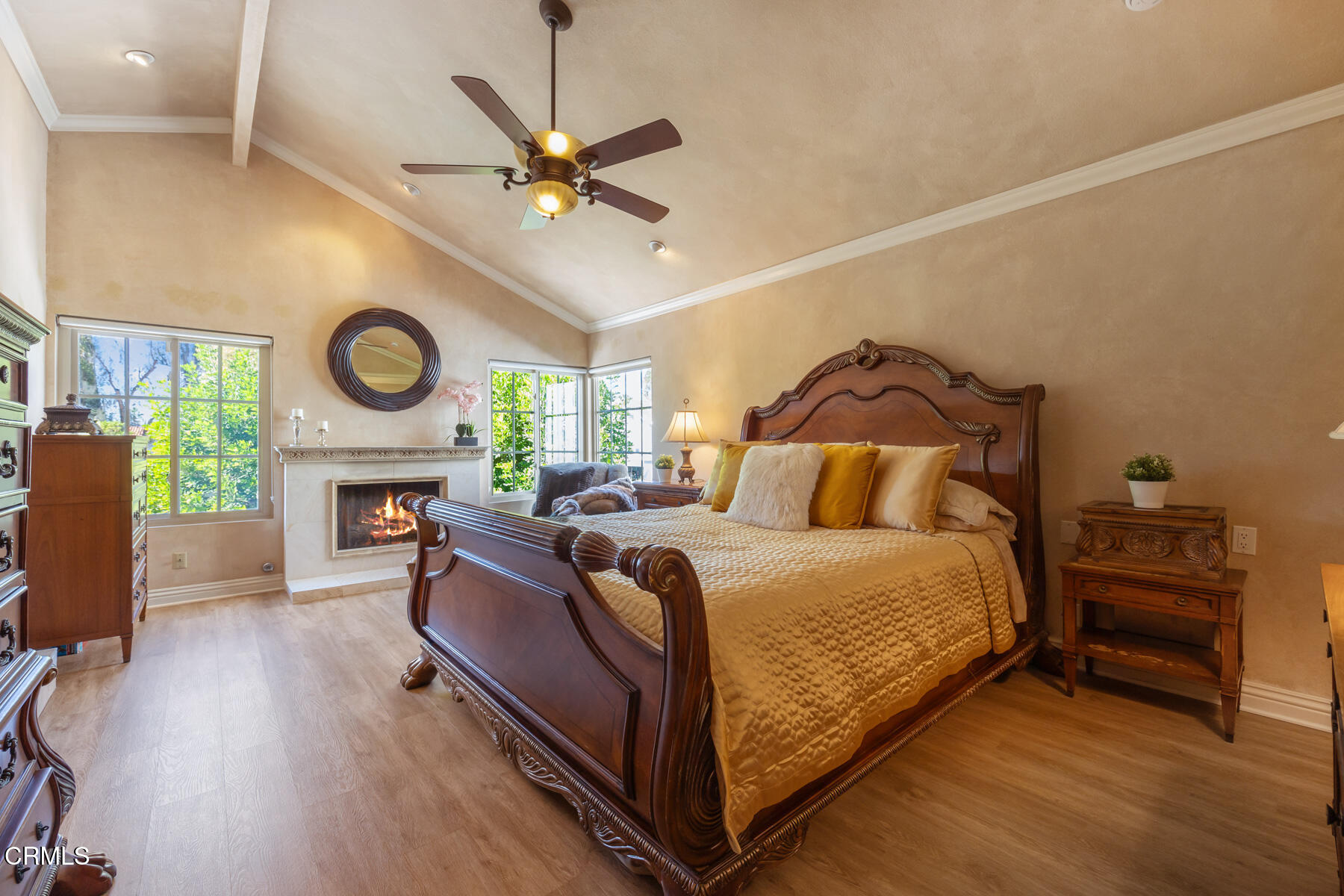 22671 Cheryl Way Lake Forest, CA 92630 - Photo 23 of 51 a bed room with a bed and a fireplace