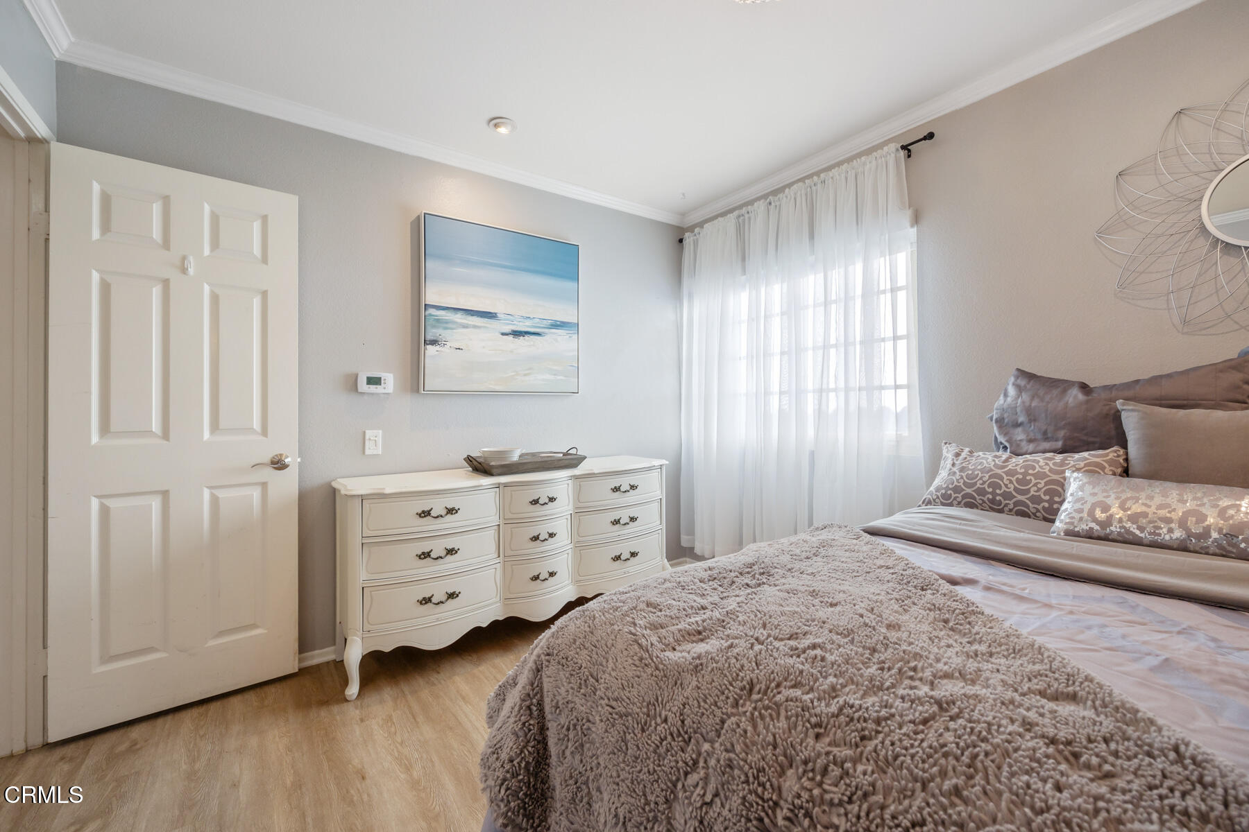 22671 Cheryl Way Lake Forest, CA 92630 - Photo 34 of 51 a bedroom with a bed and a dresser