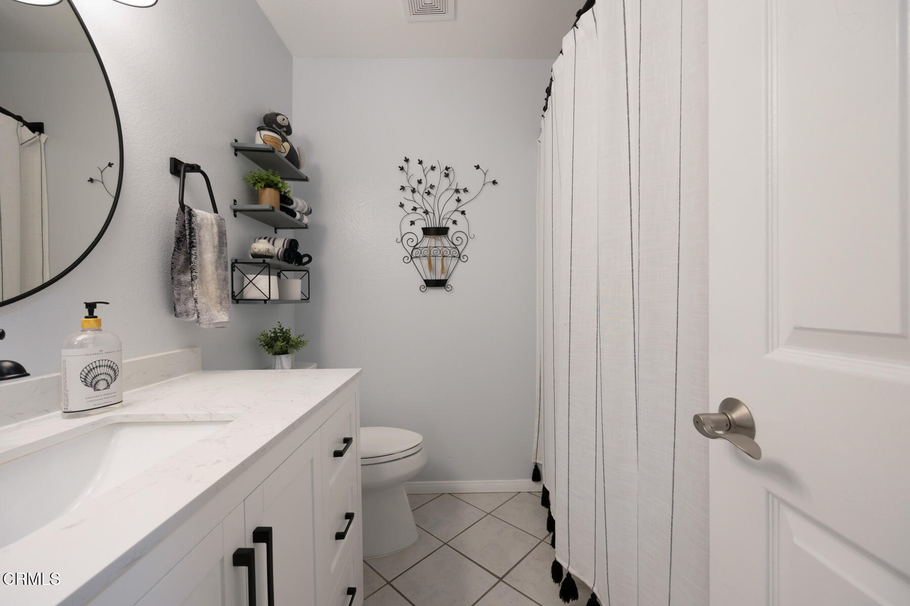 22671 Cheryl Way Lake Forest, CA 92630 - Photo 35 of 51 a bathroom with a sink toilet and shower