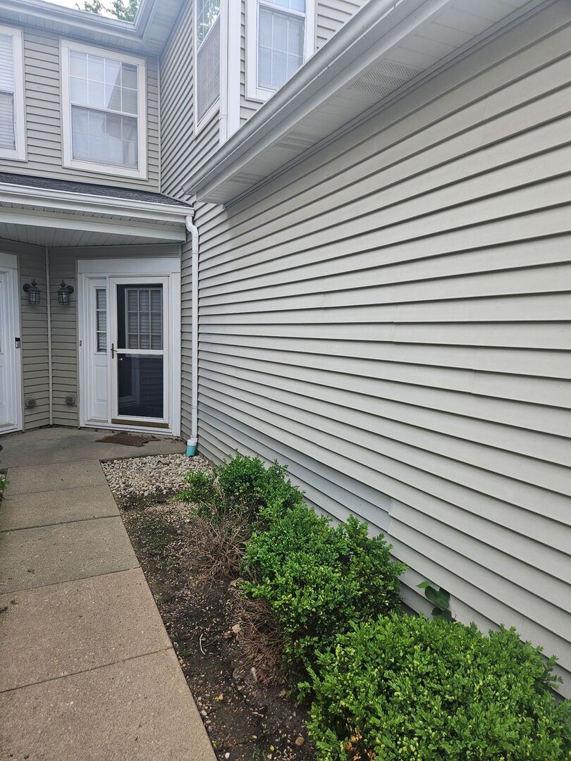 348 Fallbrook Court Schaumburg, IL 60107 - Photo 2 of 21 a view of a white building with many windows