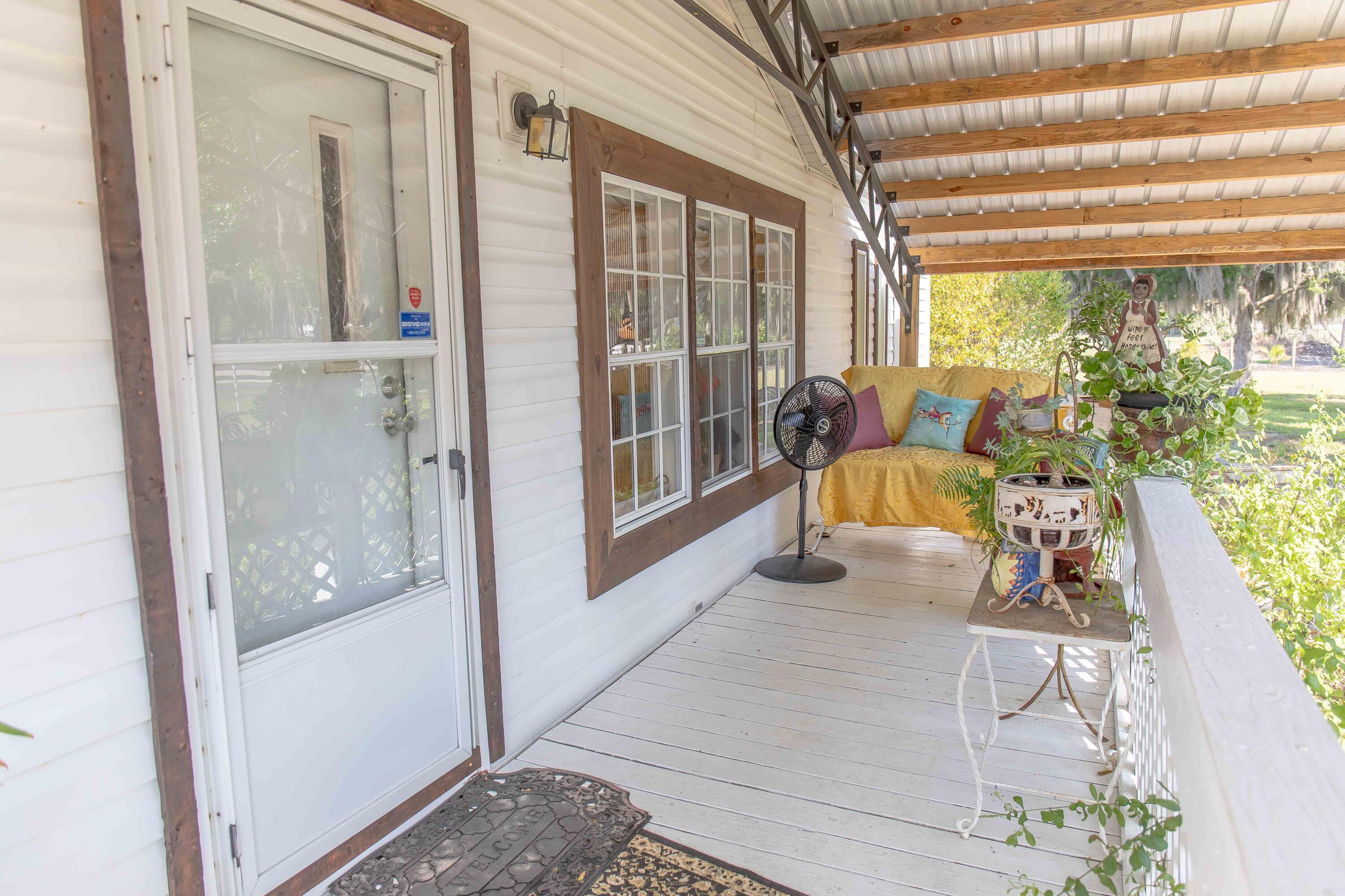 12302 Highway 441 Okeechobee, FL 34974 - Photo 11 of 63 a living room with furniture and a large window