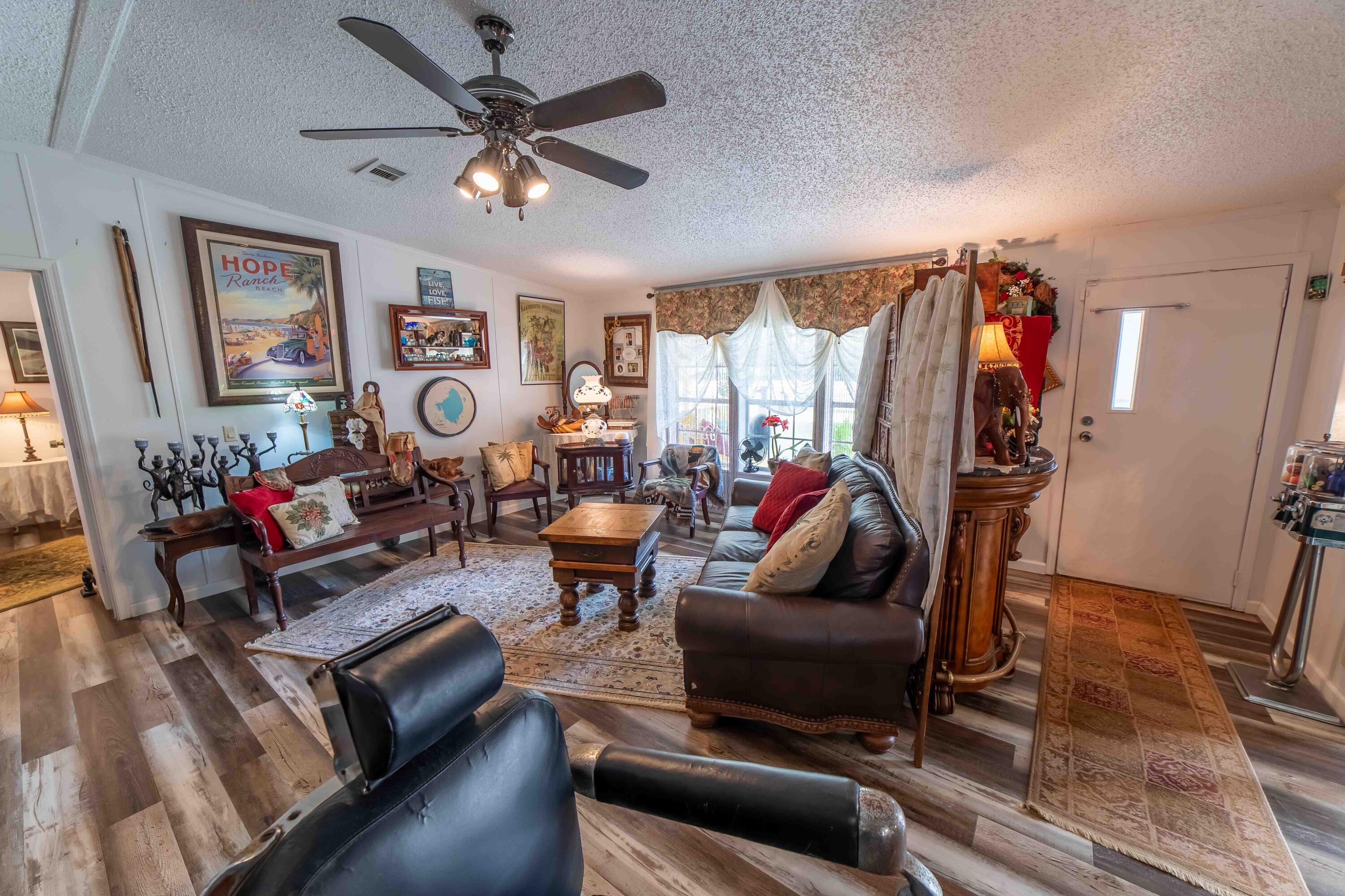 12302 Highway 441 Okeechobee, FL 34974 - Photo 13 of 63 a living room with furniture or couch and a window