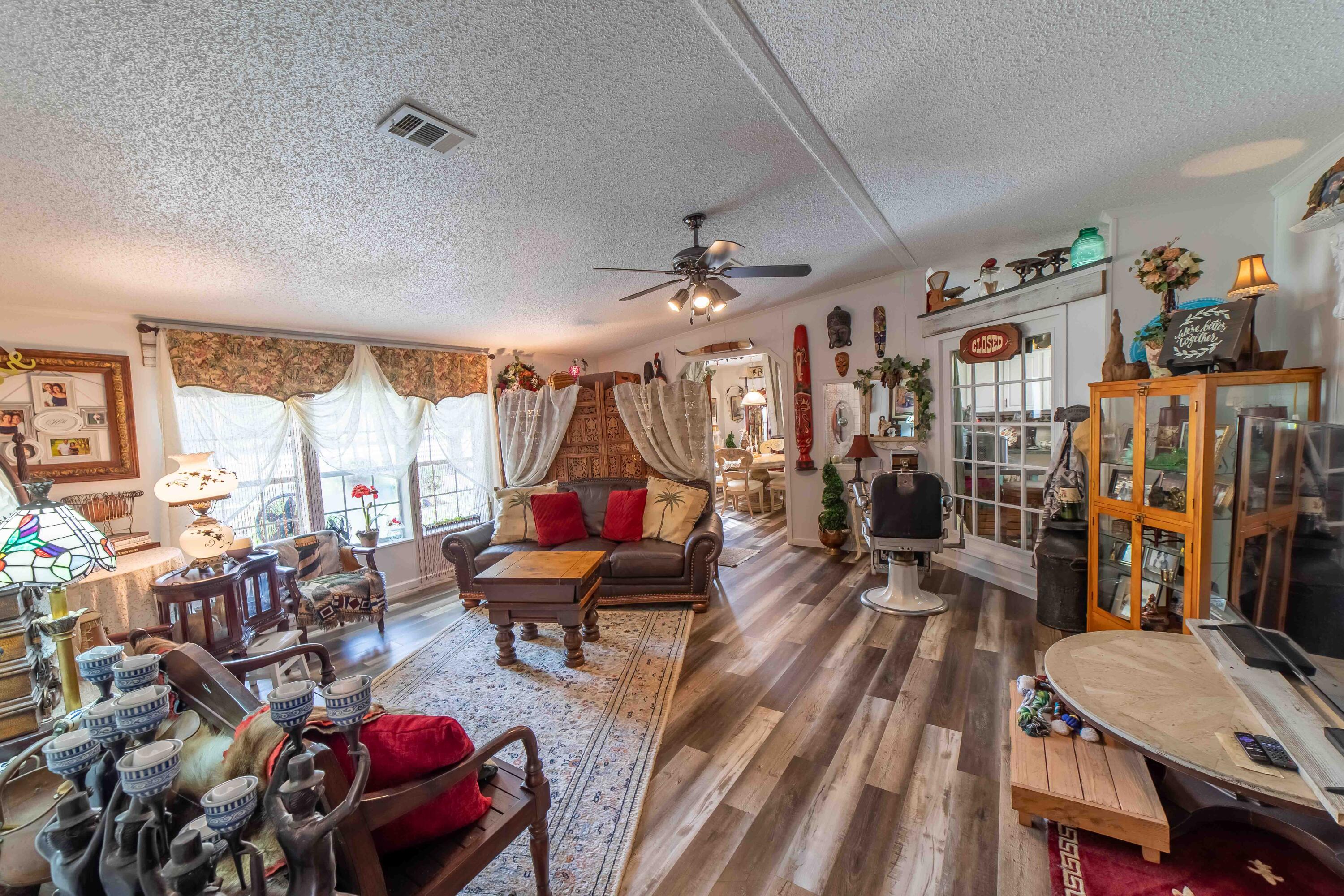 12302 Highway 441 Okeechobee, FL 34974 - Photo 14 of 63 a living room filled with furniture