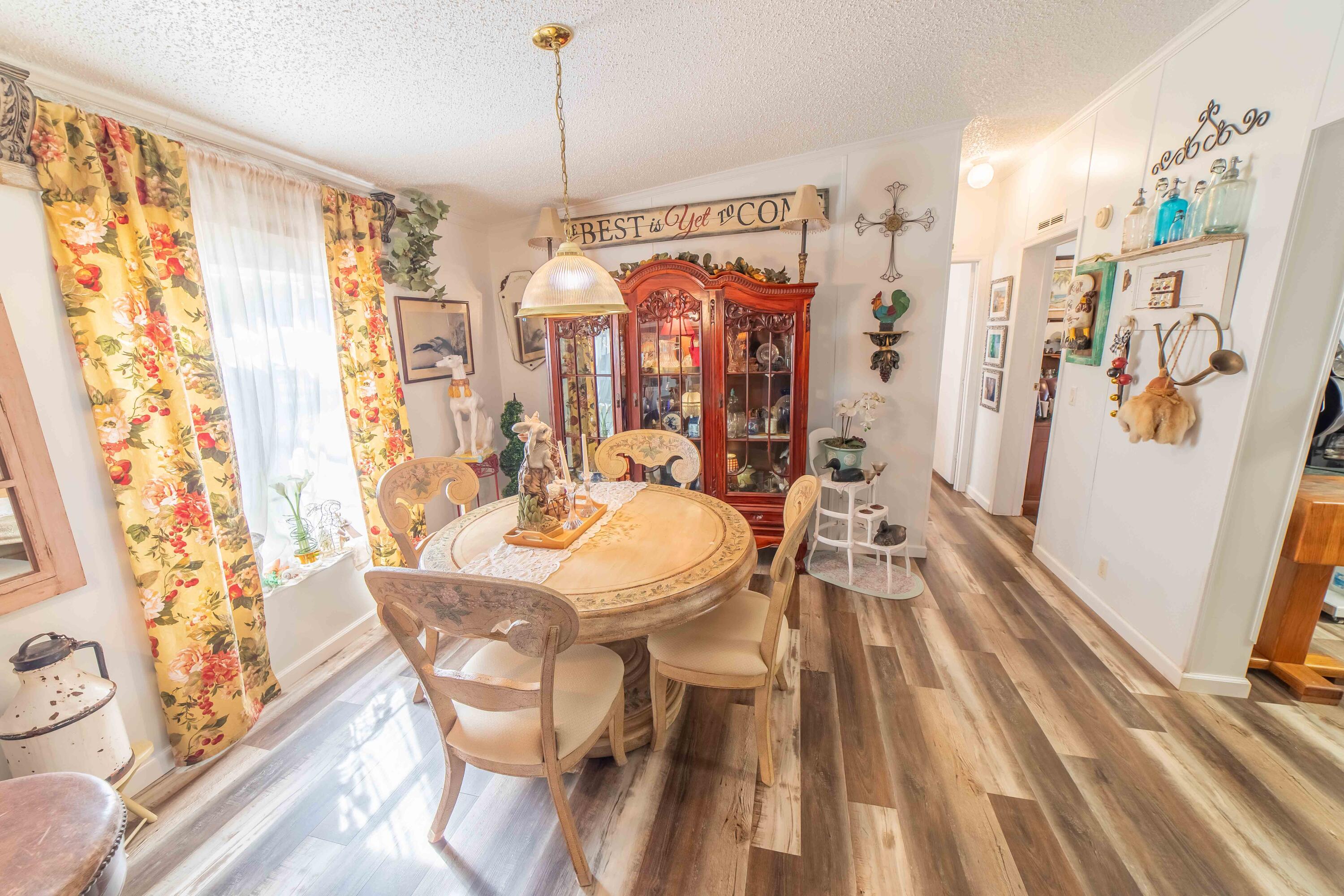 12302 Highway 441 Okeechobee, FL 34974 - Photo 17 of 63 a view of a dining room with furniture window and wooden floor
