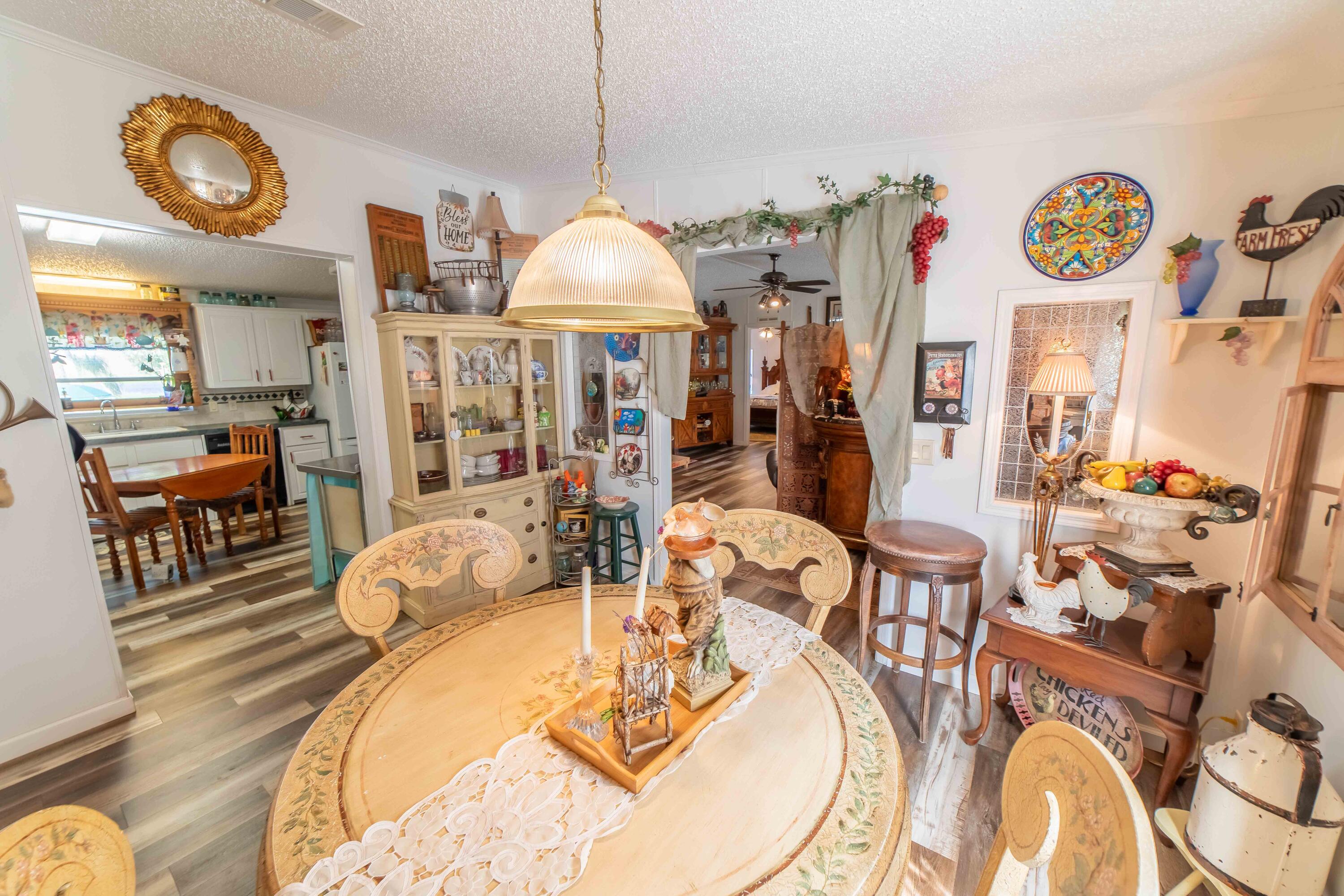 12302 Highway 441 Okeechobee, FL 34974 - Photo 18 of 63 a view of a dining room and hall with furniture