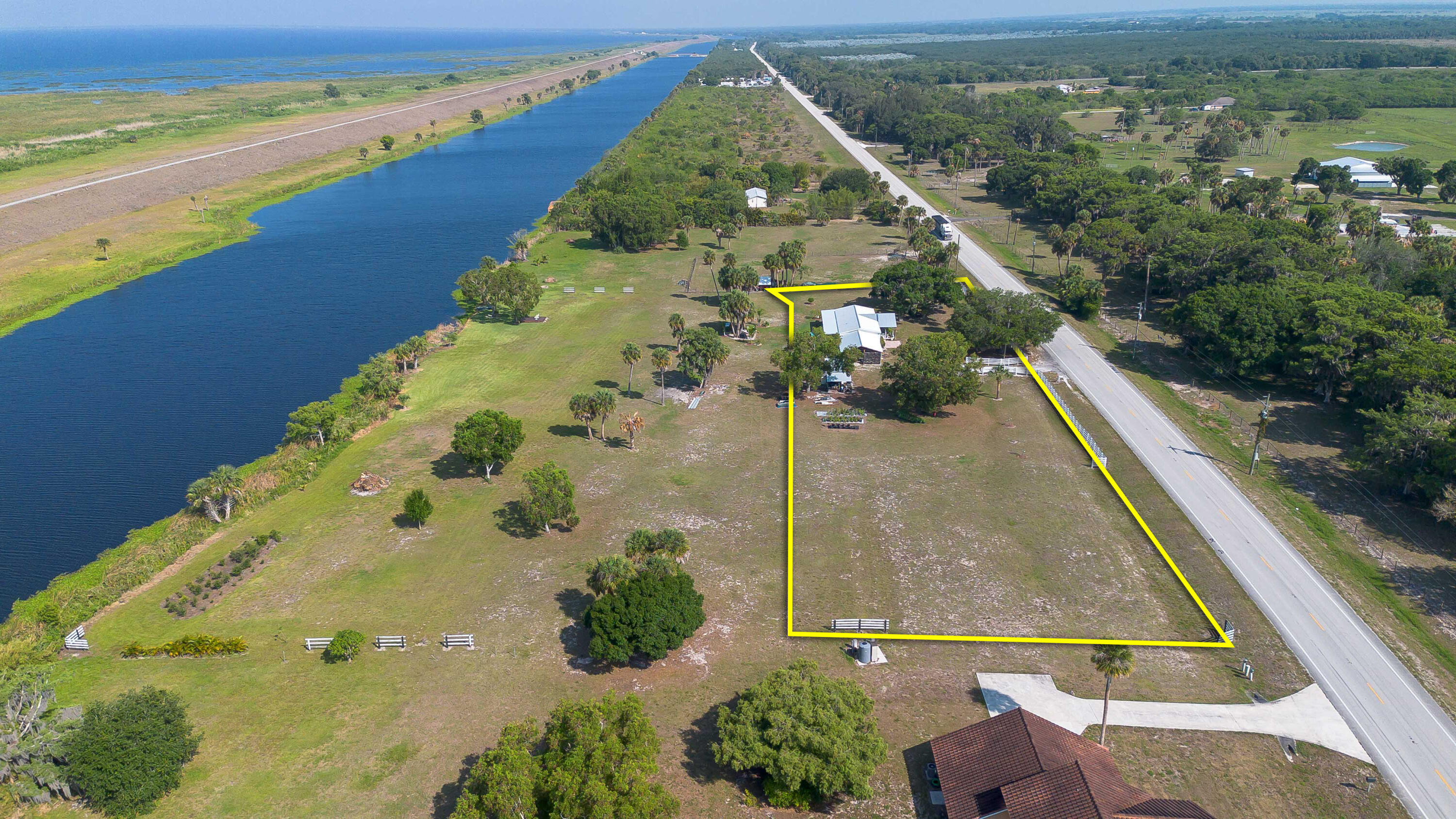 12302 Highway 441 Okeechobee, FL 34974 - Photo 3 of 63 an aerial view of a residential houses with outdoor space