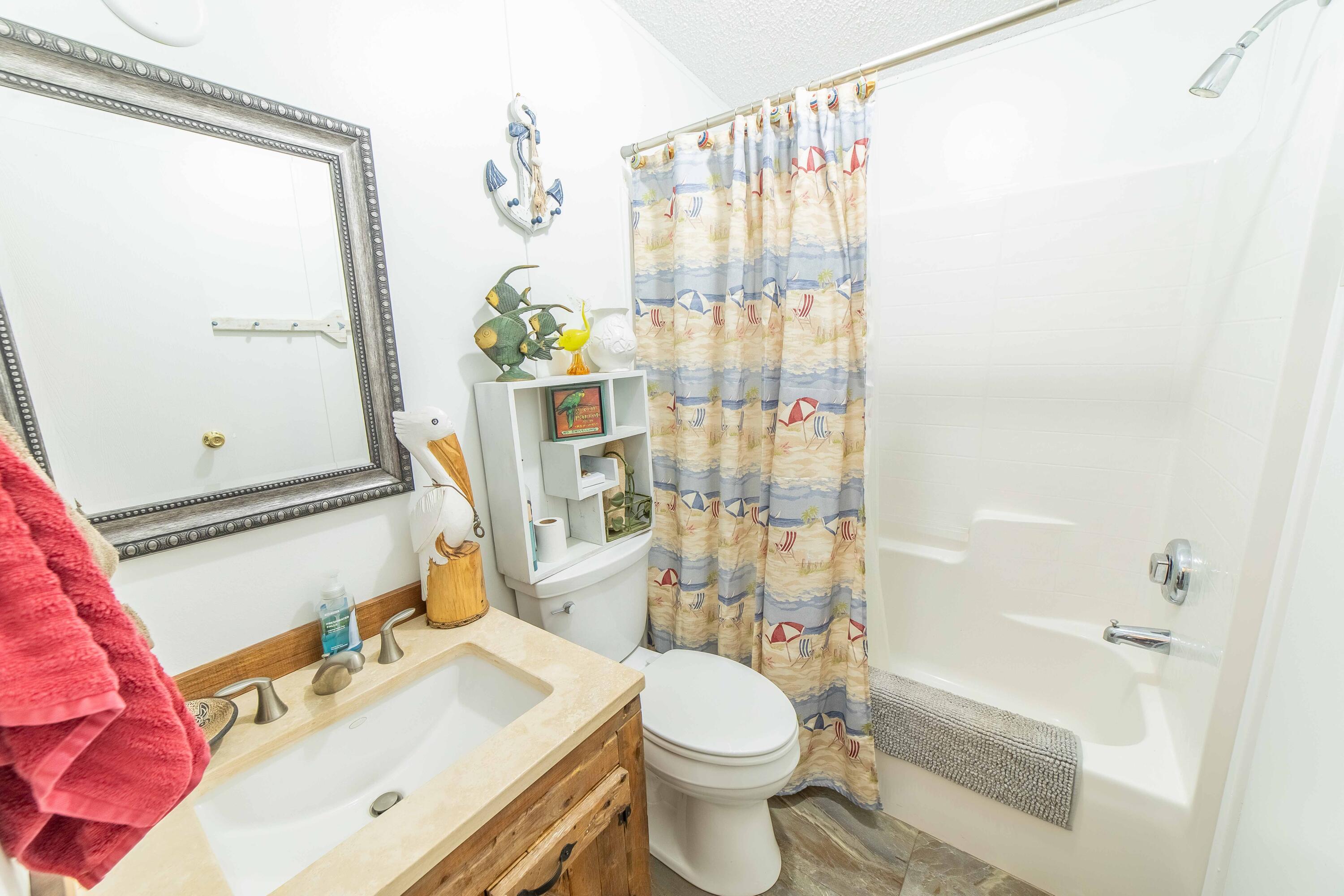 12302 Highway 441 Okeechobee, FL 34974 - Photo 34 of 63 a bathroom with a sink toilet and shower