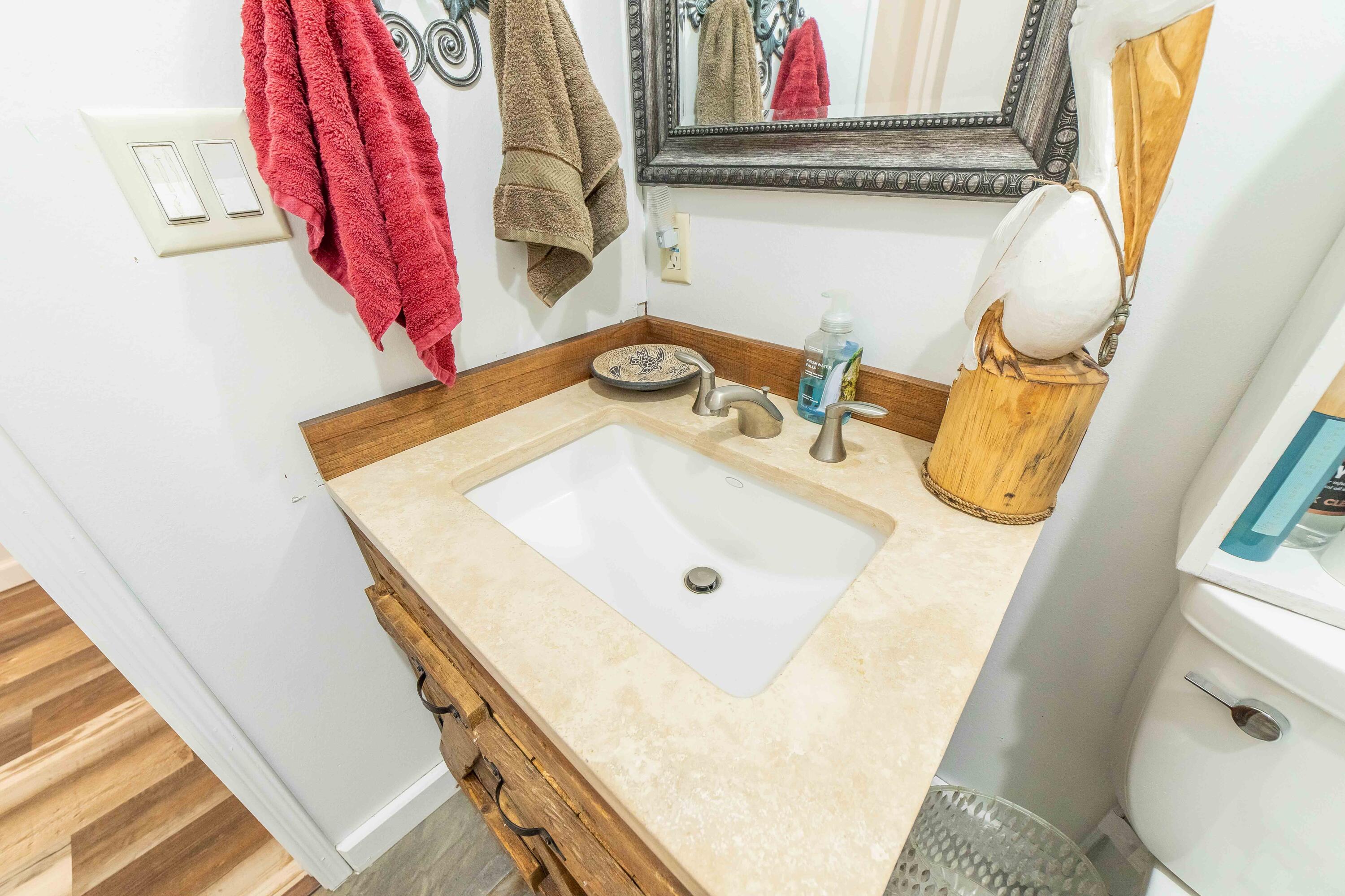 12302 Highway 441 Okeechobee, FL 34974 - Photo 35 of 63 a bathroom with a sink and a mirror