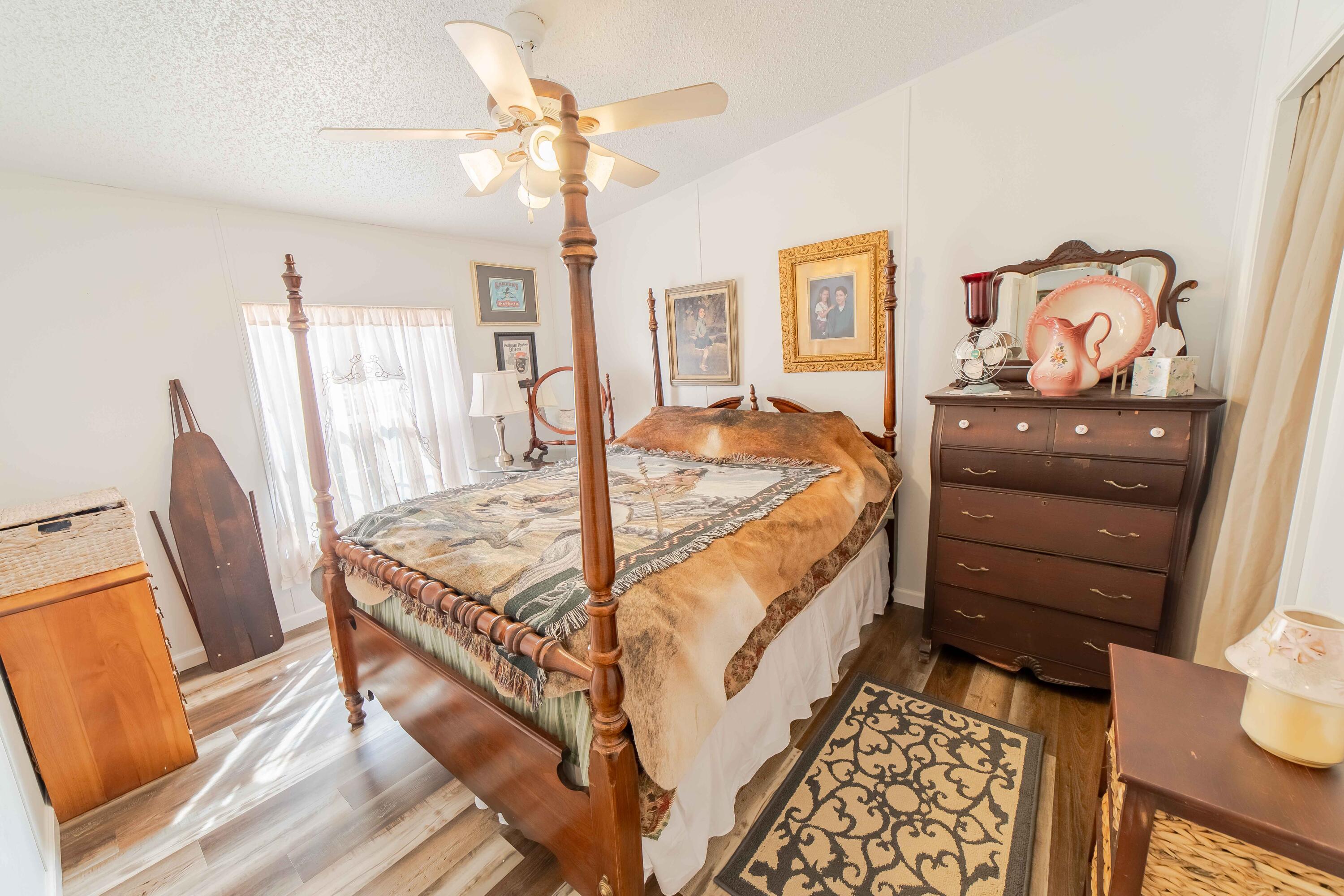 12302 Highway 441 Okeechobee, FL 34974 - Photo 36 of 63 a bed room with a bed and a dresser