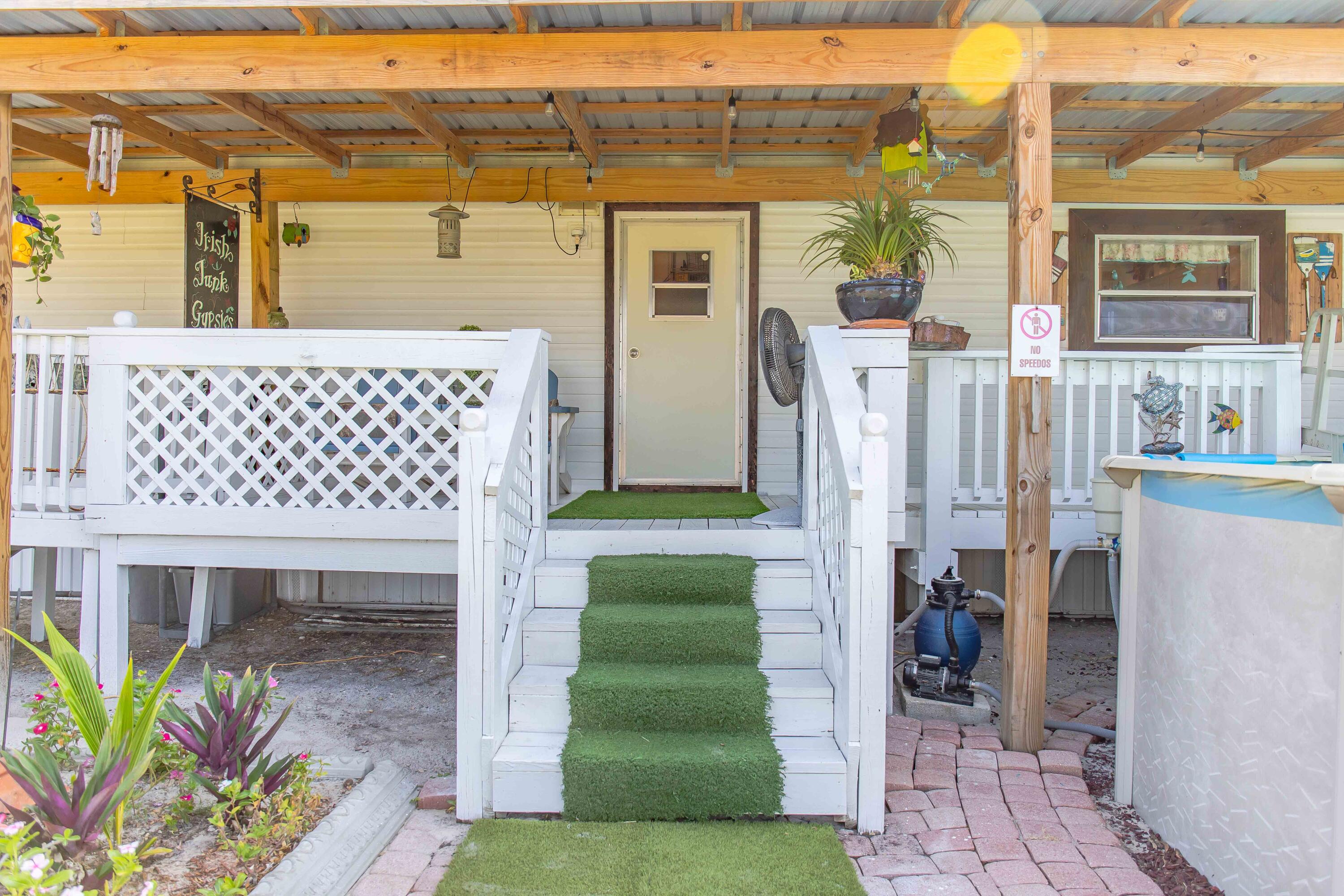 12302 Highway 441 Okeechobee, FL 34974 - Photo 38 of 63 a front view of a house with a yard