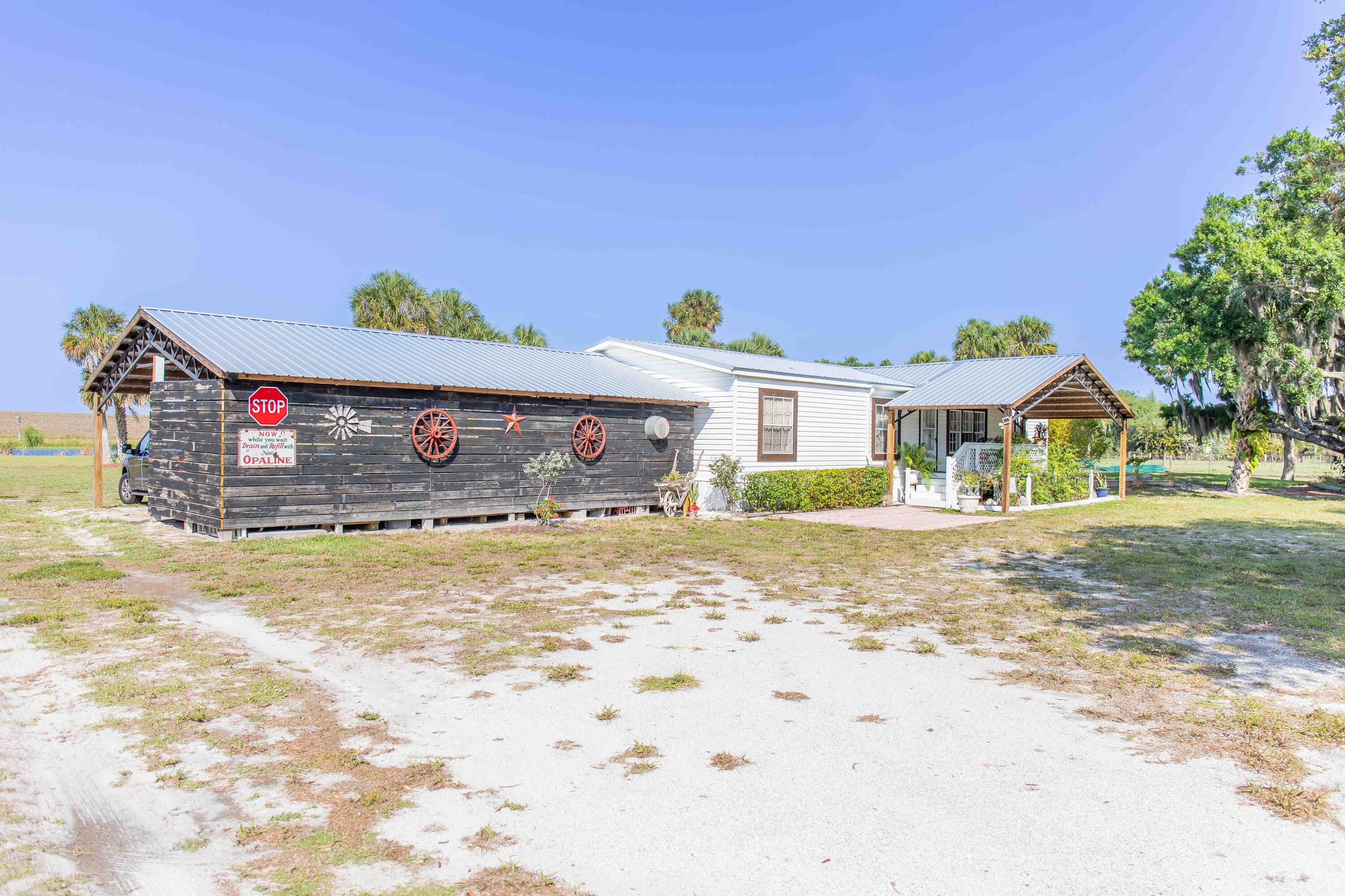12302 Highway 441 Okeechobee, FL 34974 - Photo 44 of 63 a view of the house with a outdoor space