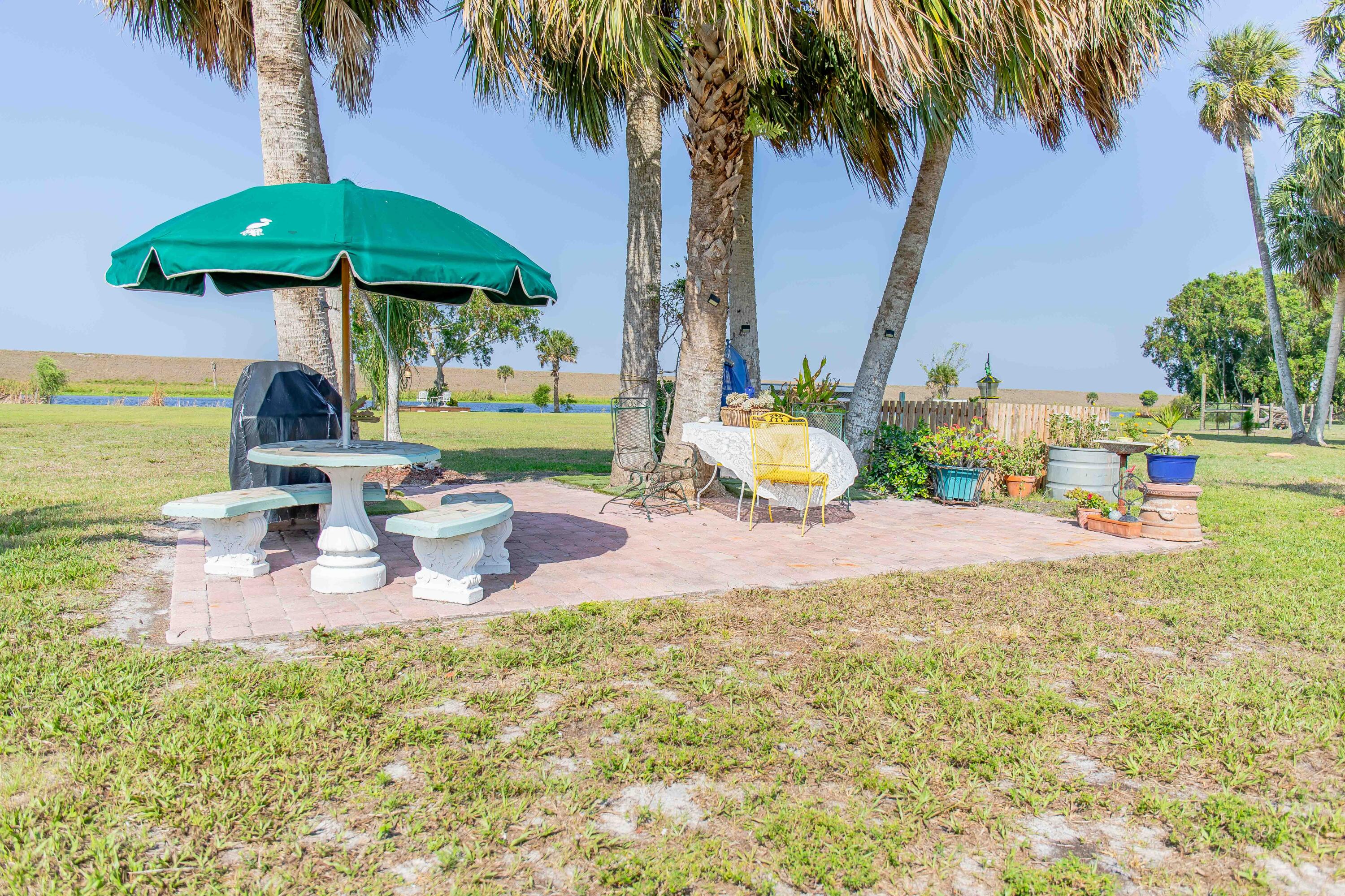 12302 Highway 441 Okeechobee, FL 34974 - Photo 47 of 63 a view of a swimming pool with a patio
