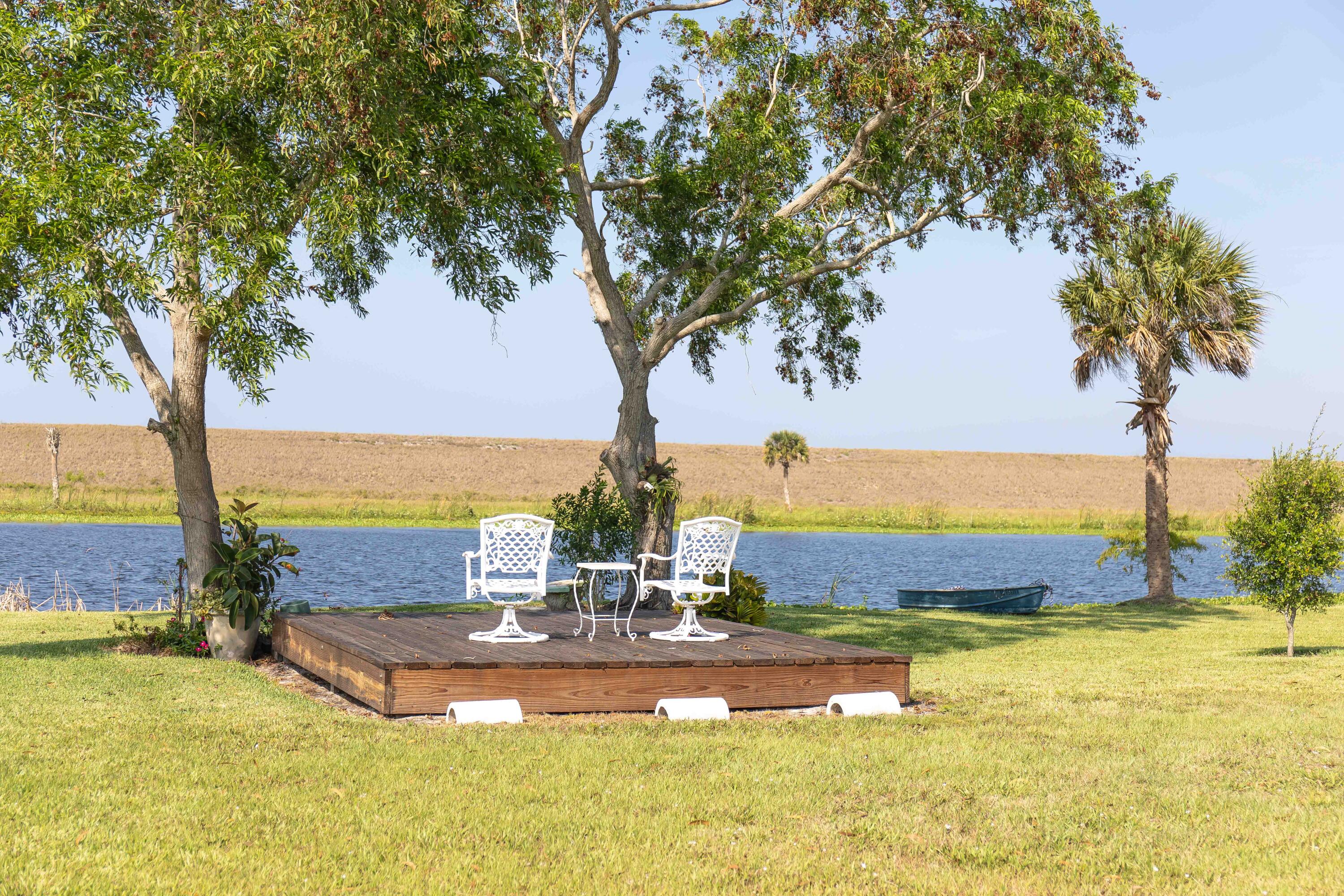 12302 Highway 441 Okeechobee, FL 34974 - Photo 51 of 63 a view of a swimming pool with an ocean view