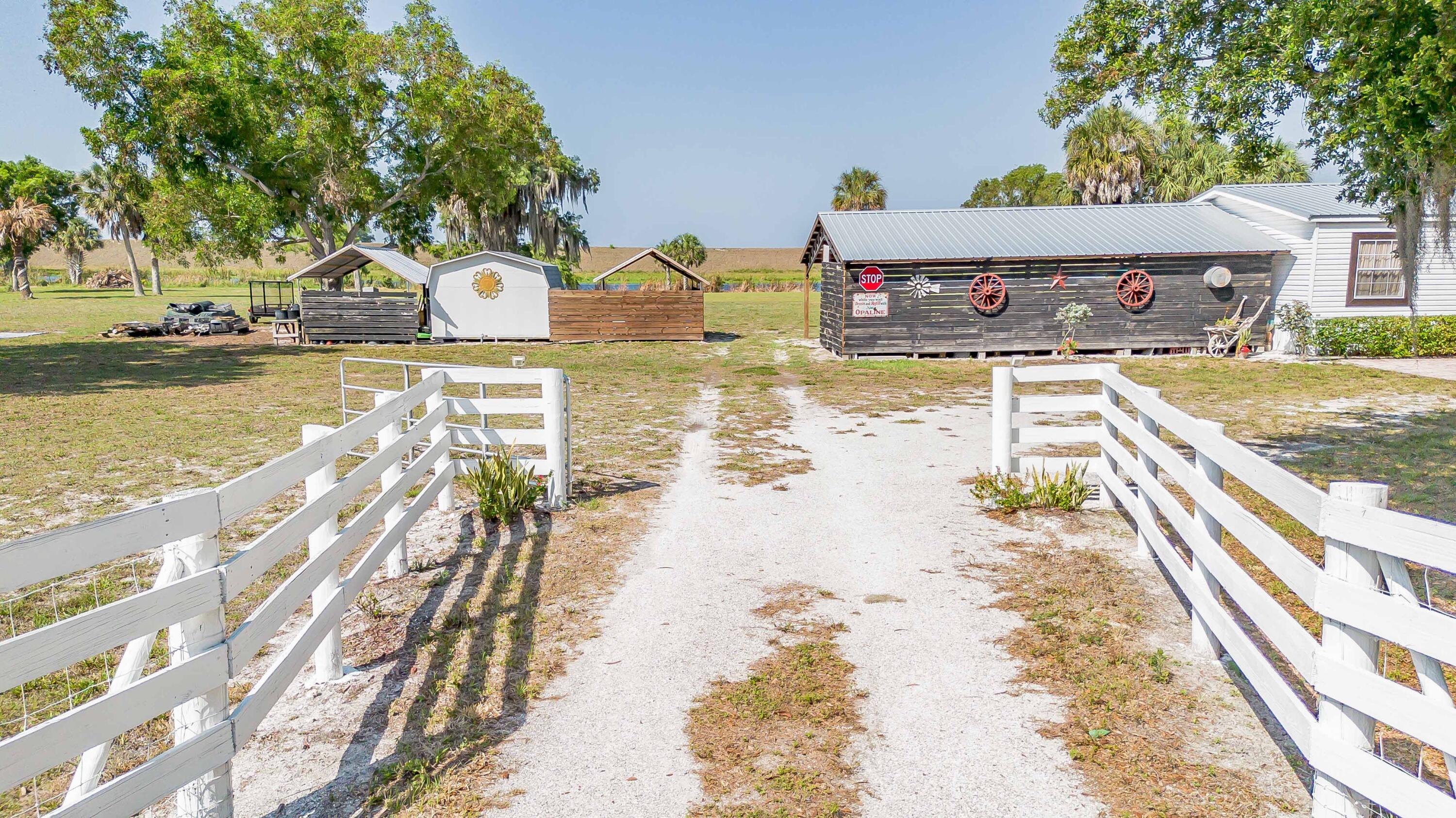 12302 Highway 441 Okeechobee, FL 34974 - Photo 55 of 63 a view of a swimming pool with a chair
