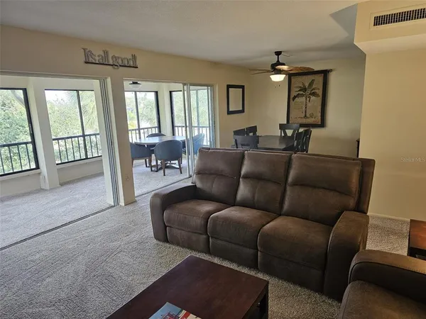 a living room with furniture and a window