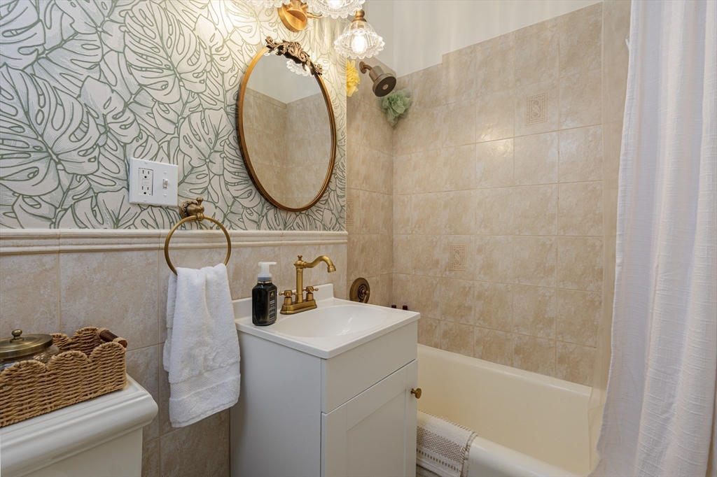 354 North Main Street, Unit 214 Andover, MA 01810 - Photo 11 of 33 a bathroom with a sink and a mirror