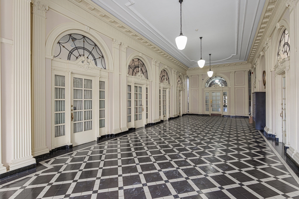354 North Main Street, Unit 214 Andover, MA 01810 - Photo 15 of 33 a bathroom with a black and white checkered floor