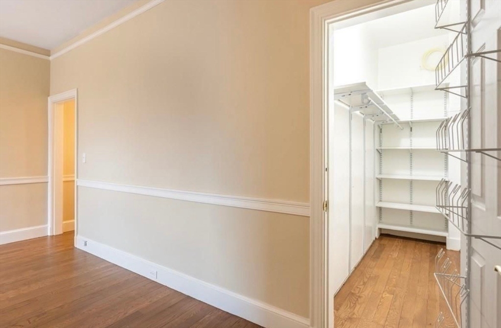 354 North Main Street, Unit 214 Andover, MA 01810 - Photo 6 of 33 a view of walk in closet with empty racks