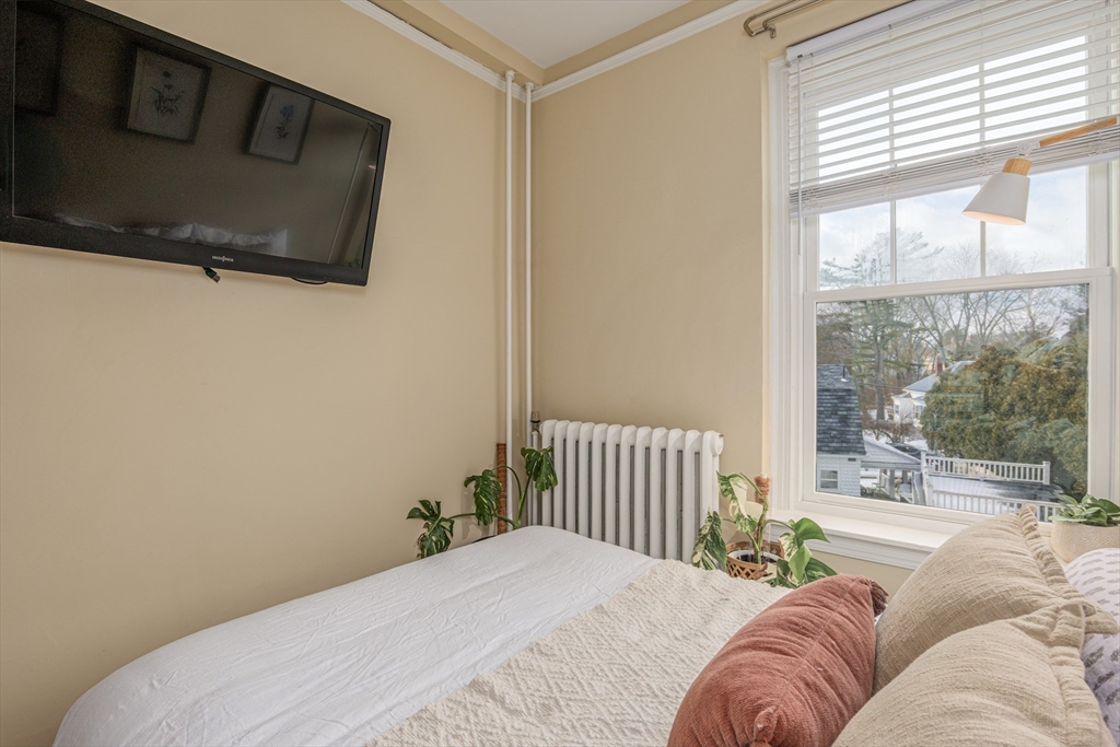 354 North Main Street, Unit 214 Andover, MA 01810 - Photo 8 of 33 a bedroom with a bed and a window