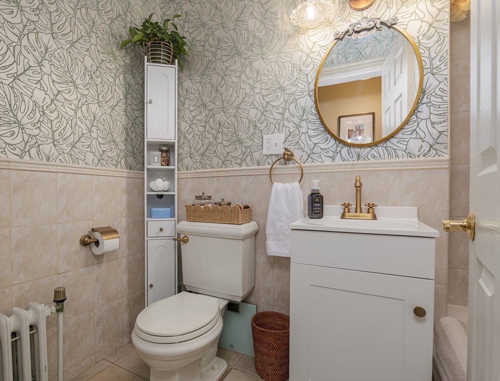 354 North Main Street, Unit 214 Andover, MA 01810 - Photo 10 of 33 a bathroom with a toilet mirror and vanity
