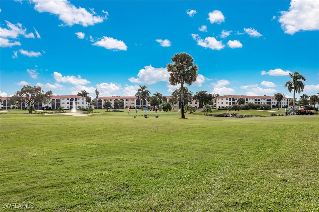 9 High Point Circle North, Unit 102 Naples, FL 34103 - Photo 30 of 48 a view of a park with lots of palm trees