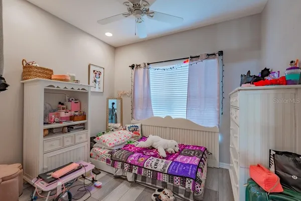 a bedroom with furniture and a bed