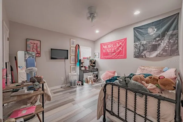 a view of a room with workspace and wooden floor