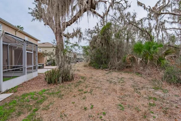 a backyard of a house with lots of green space