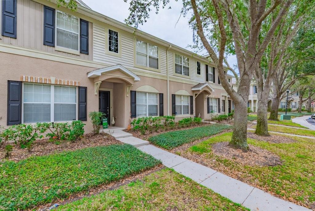 15856 Fishhawk View Drive Lithia, FL 33547 - Photo 3 of 31 a front view of a house with garden and porch