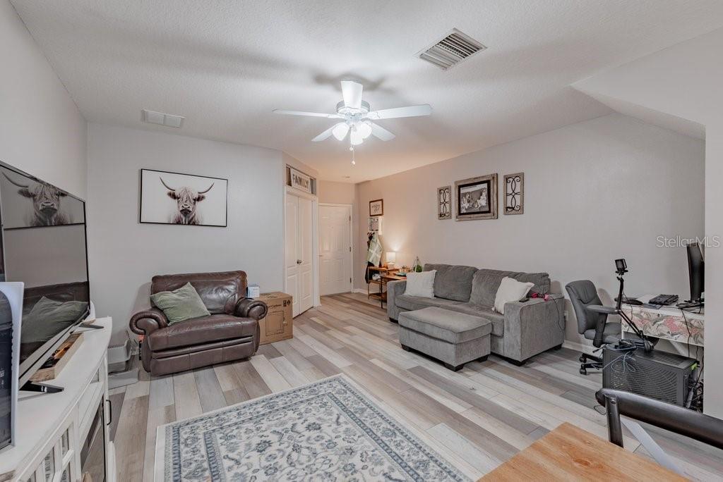 15856 Fishhawk View Drive Lithia, FL 33547 - Photo 5 of 31 a living room with furniture and a couch
