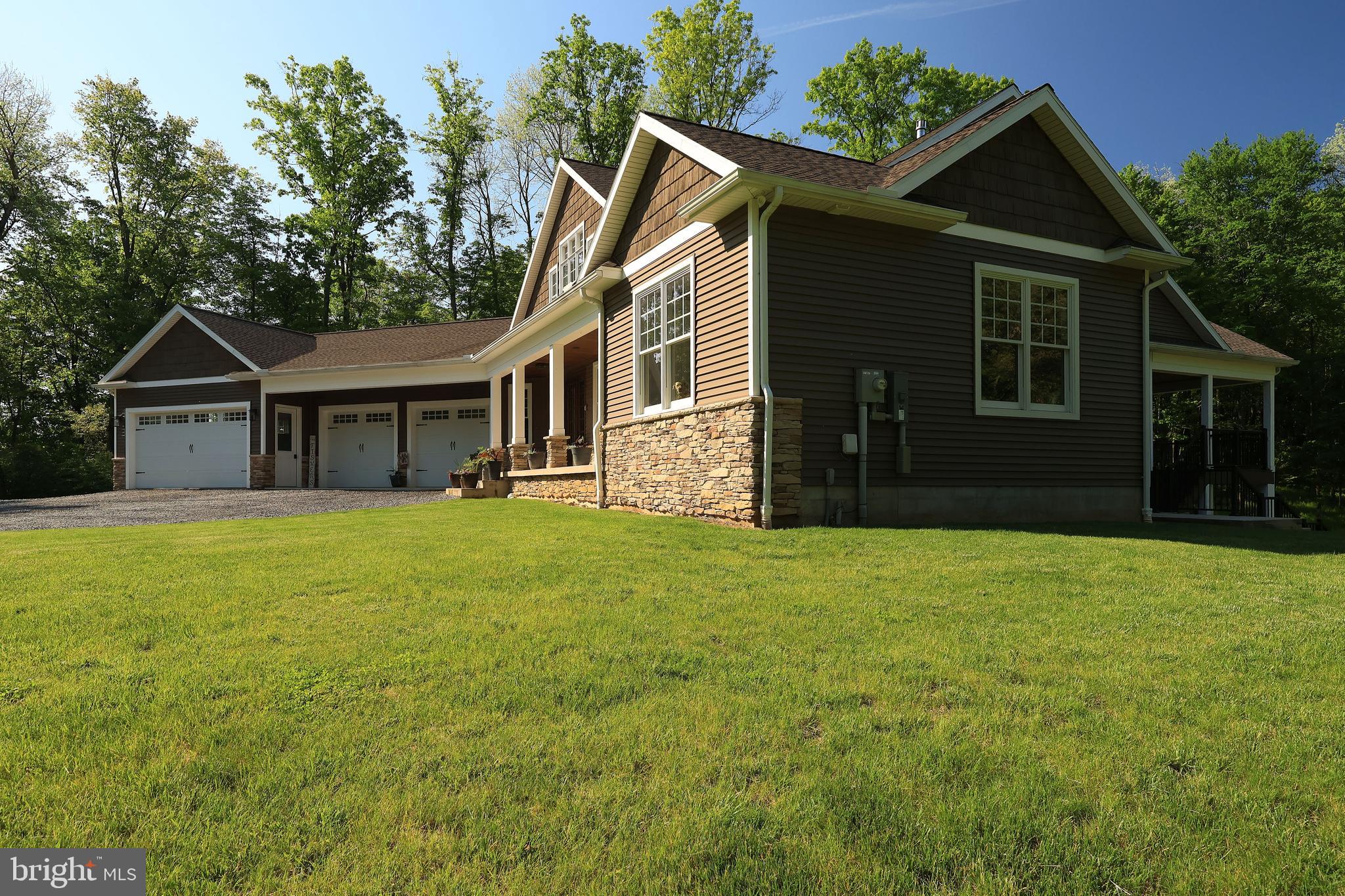 518 Two Mile Road Howard, PA 16841 - Photo 83 of 84 a front view of a house with a garden